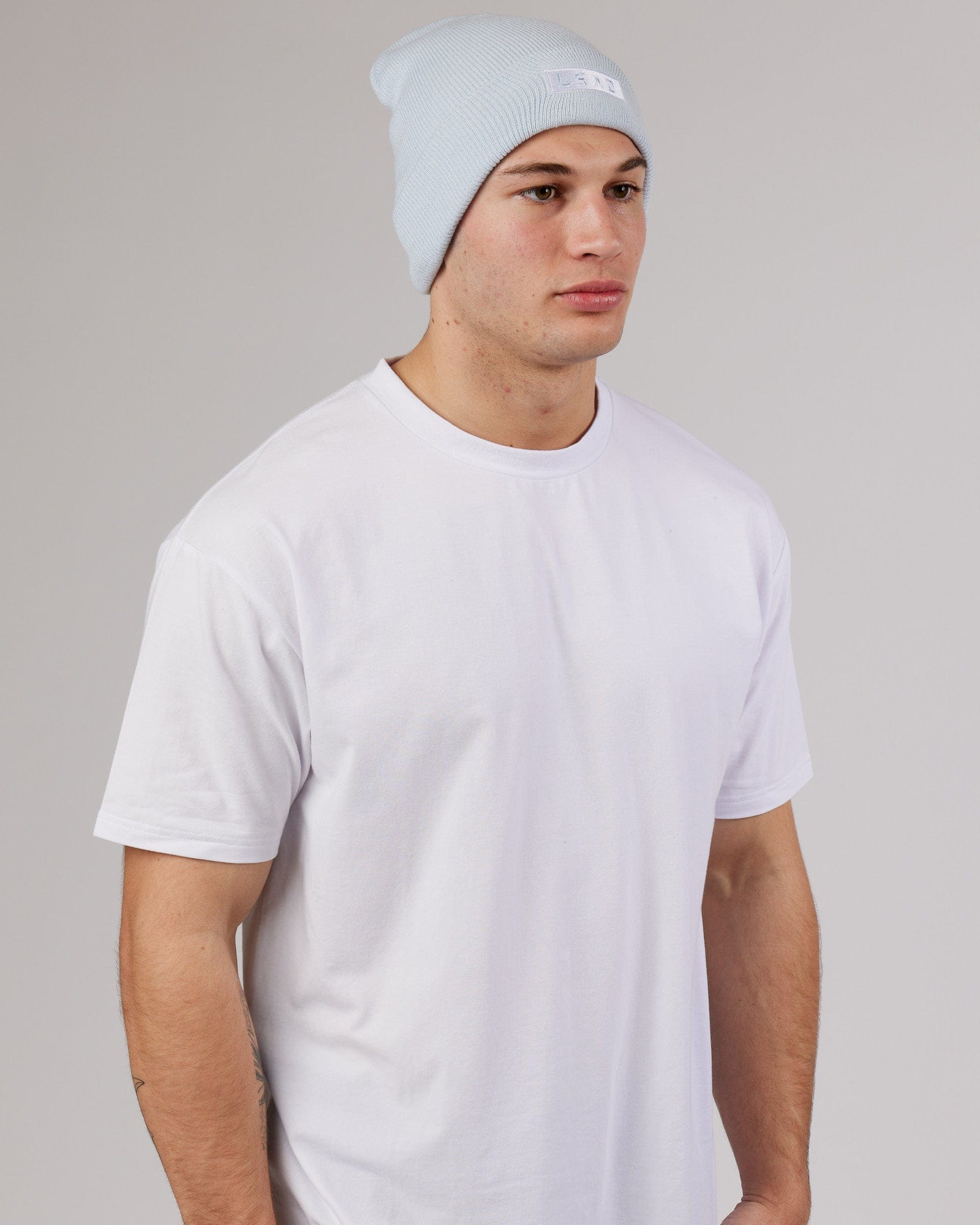 Model wearing Cornerstone Beanie - Ballad Blue