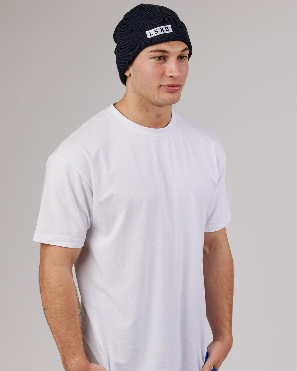 Model wearing Cornerstone Beanie - Carbon