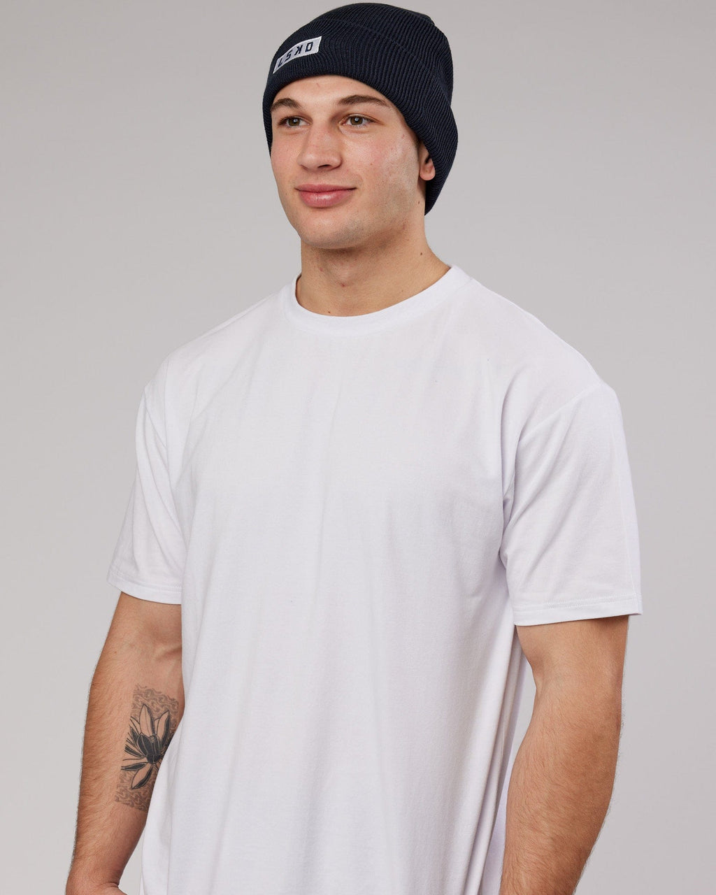 Model wearing Cornerstone Beanie - Carbon