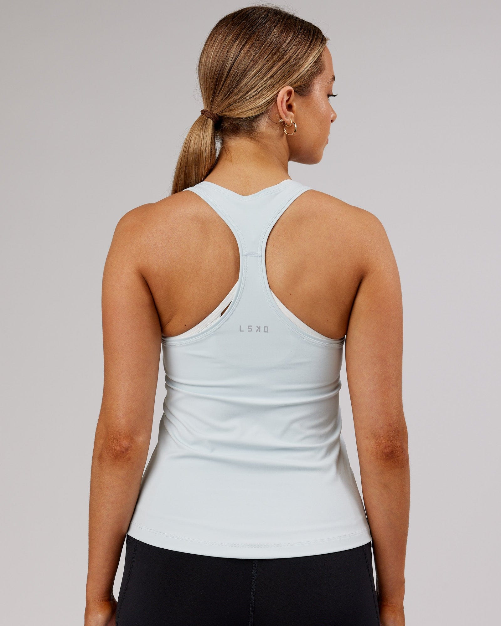 Model wearing Lift Performance Tank - Ballad Blue