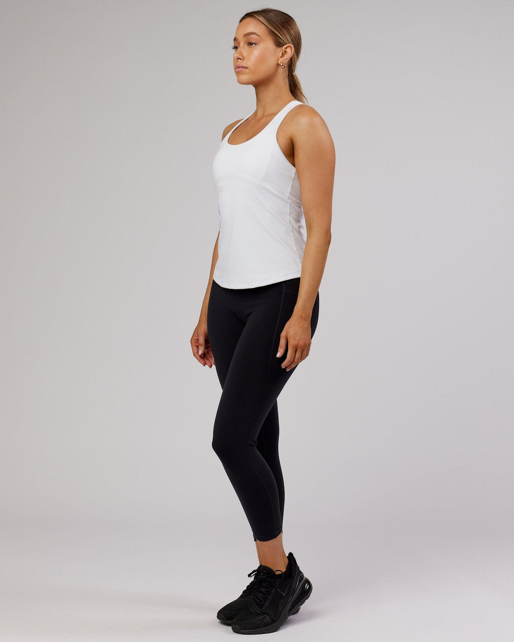 Model wearing Lift Performance Tank - White