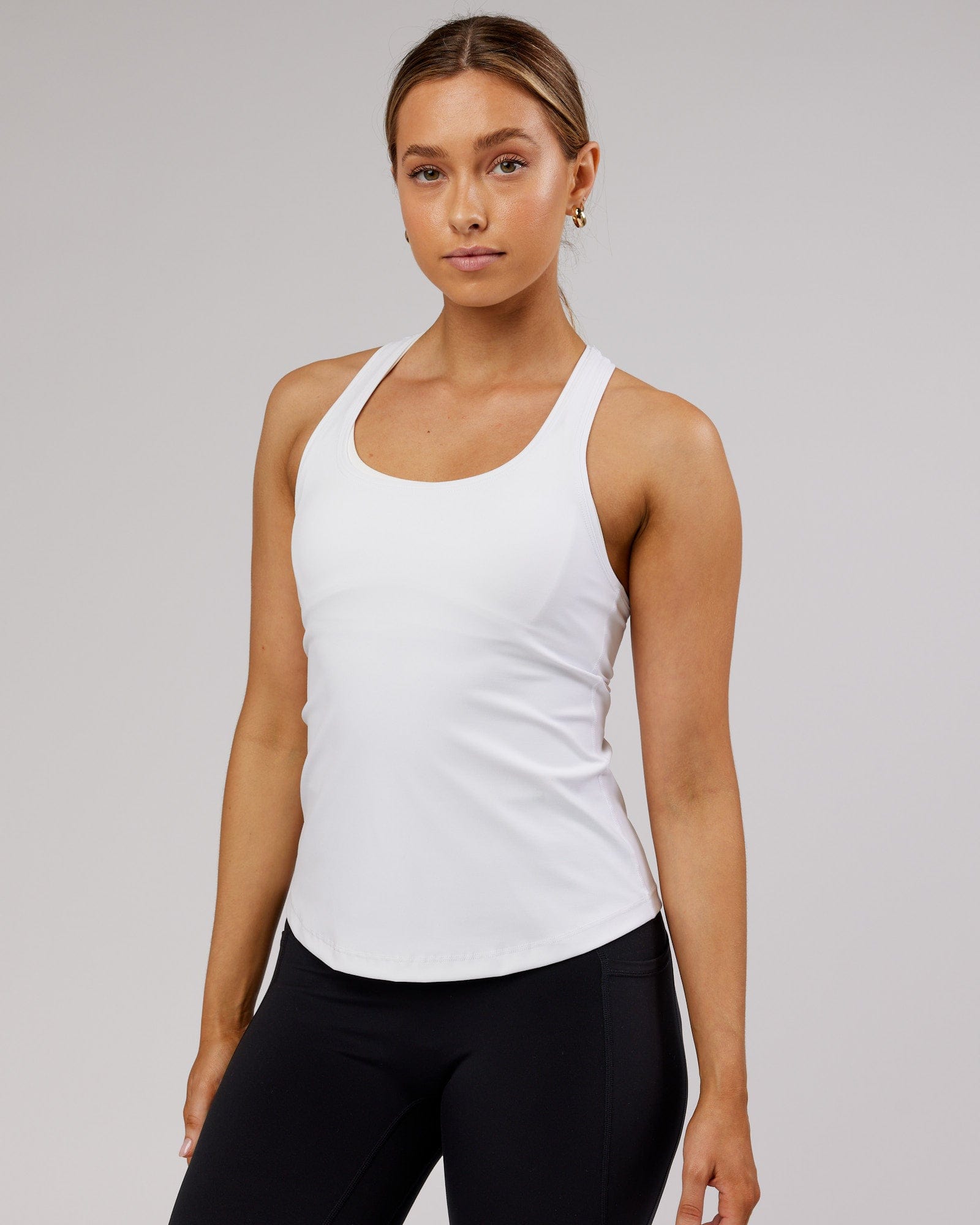 Model wearing Lift Performance Tank - White