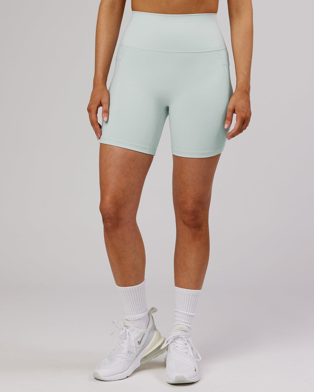 Model wearing Fusion Mid Short TIght - Ballad Blue