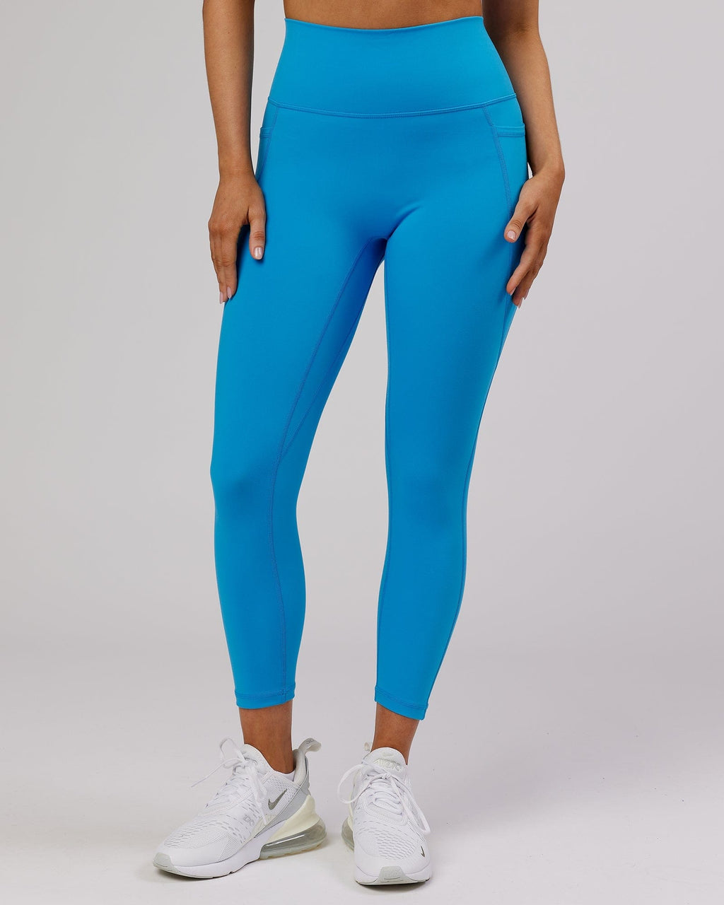 Model wearing Fusion 7/8 Length Tight - Ibiza Blue