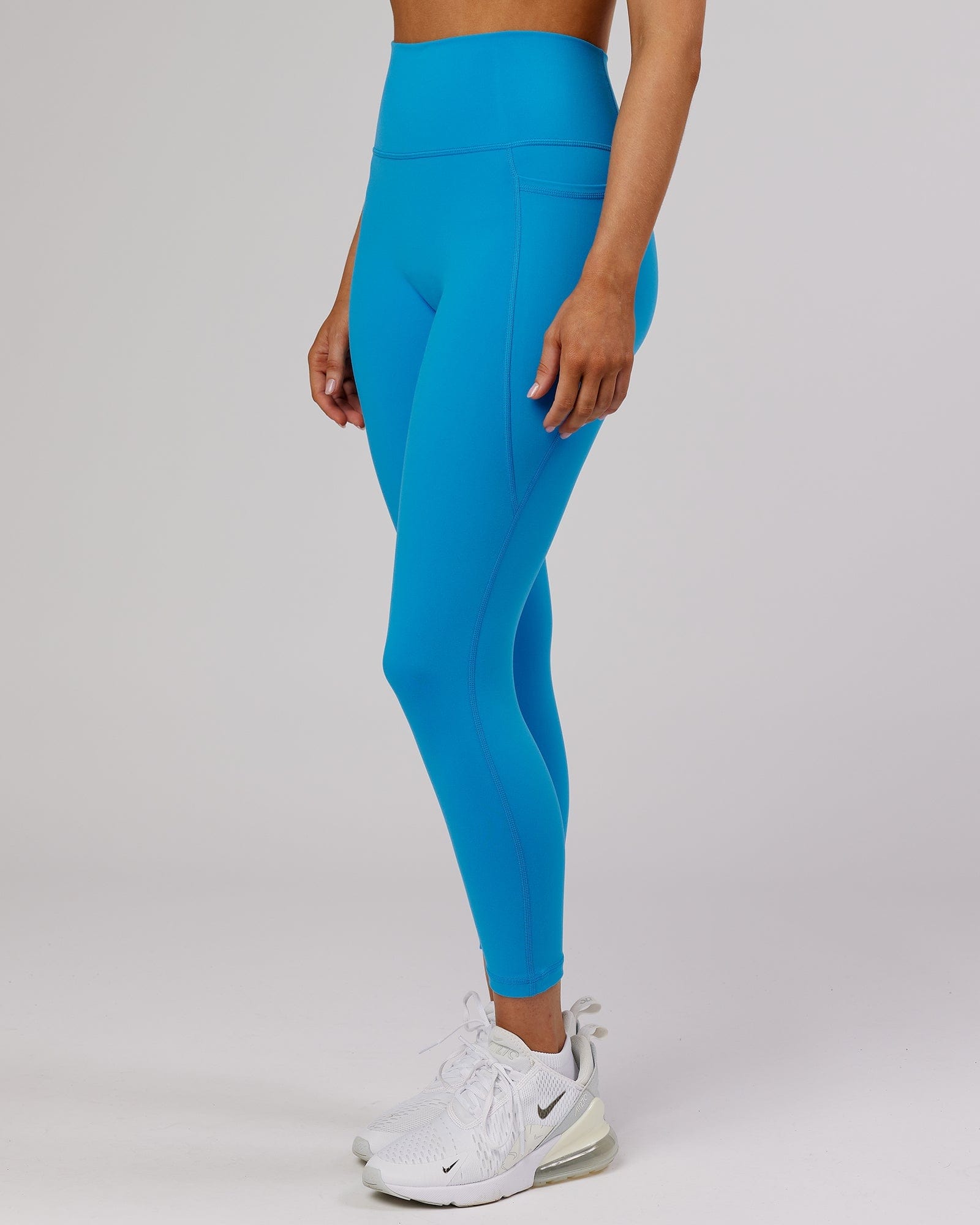Model wearing Fusion 7/8 Length Tight - Ibiza Blue