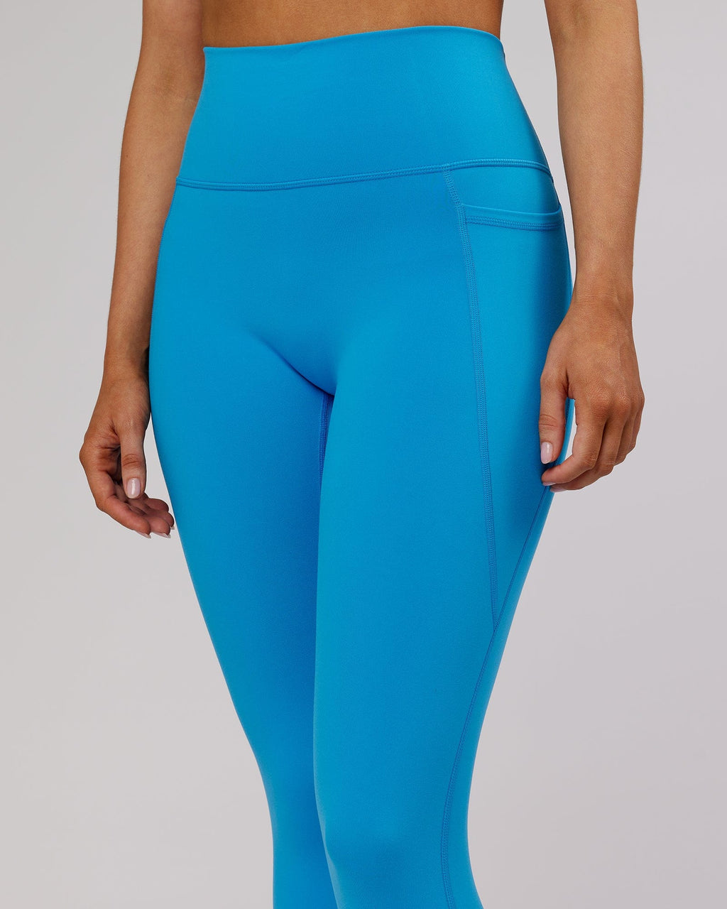 Model wearing Fusion 7/8 Length Tight - Ibiza Blue