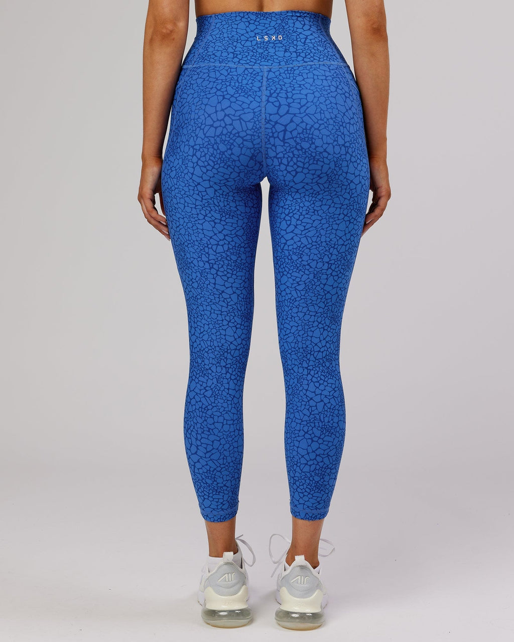 Model wearing Fusion 7/8 Length Tight - Ocean Scale