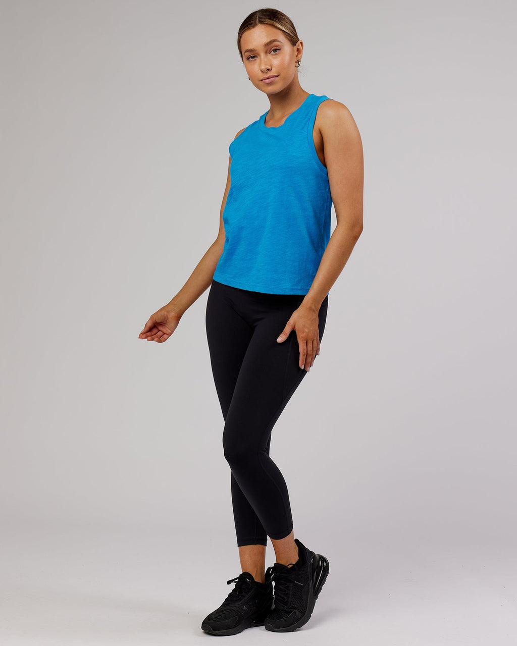 Model wearing Breathe Tank - Ibiza Blue