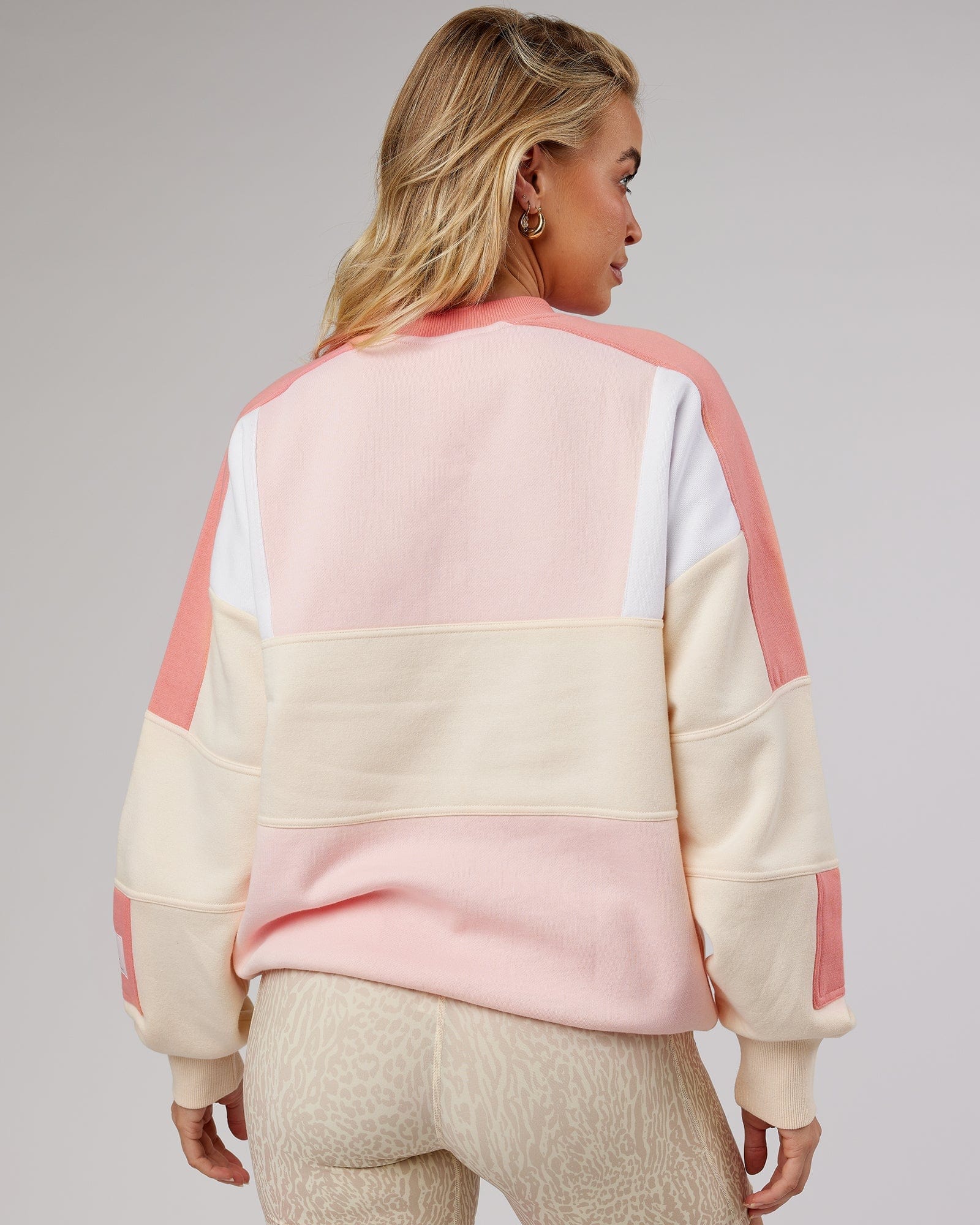 Model wearing Unisex Slam Oversize Sweater - Peach Multi