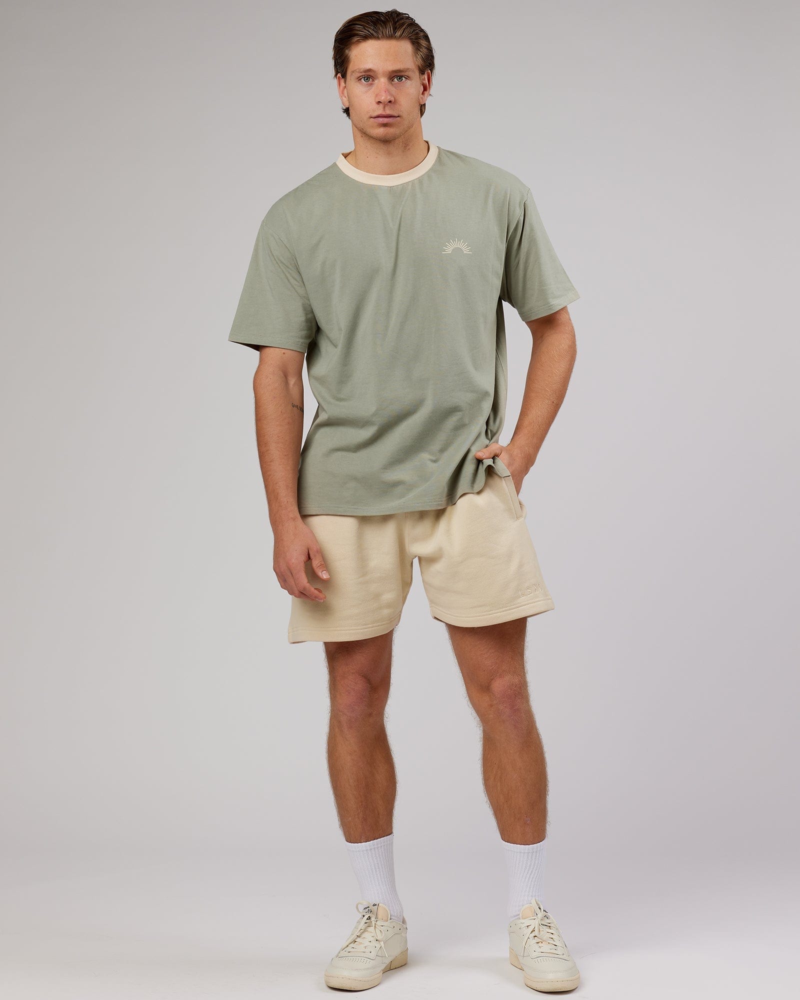 Model wearing Unisex Rise FLXCotton Oversize Tee - Sage