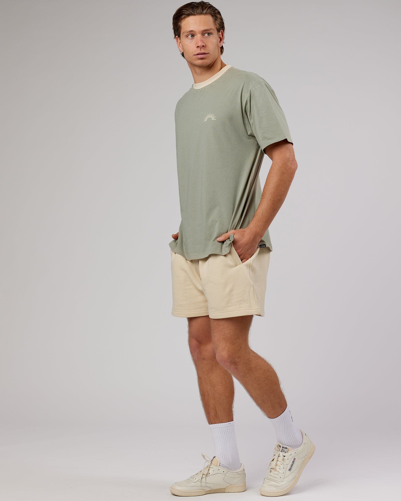 Model wearing Unisex Rise FLXCotton Oversize Tee - Sage