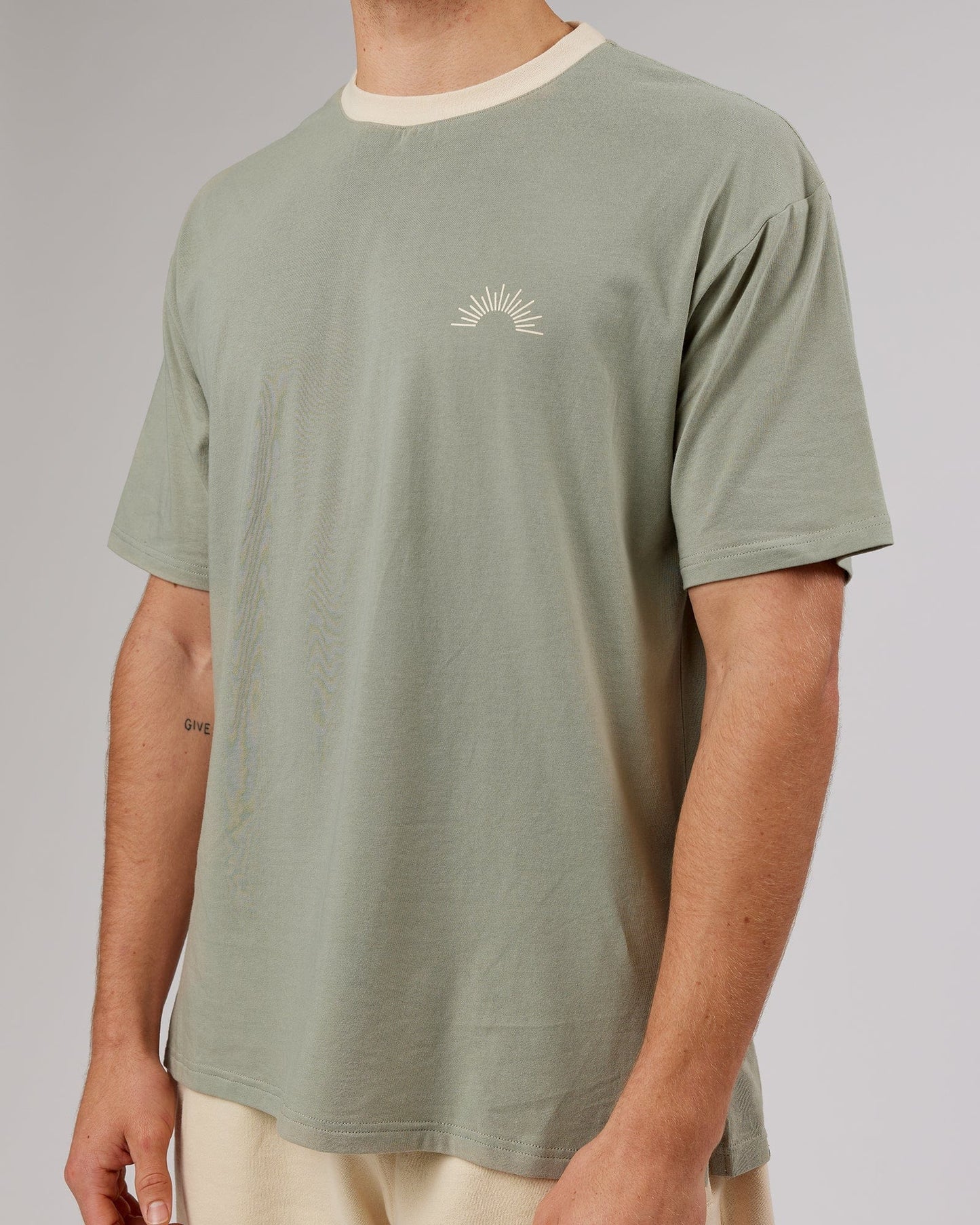 Model wearing Unisex Rise FLXCotton Oversize Tee - Sage