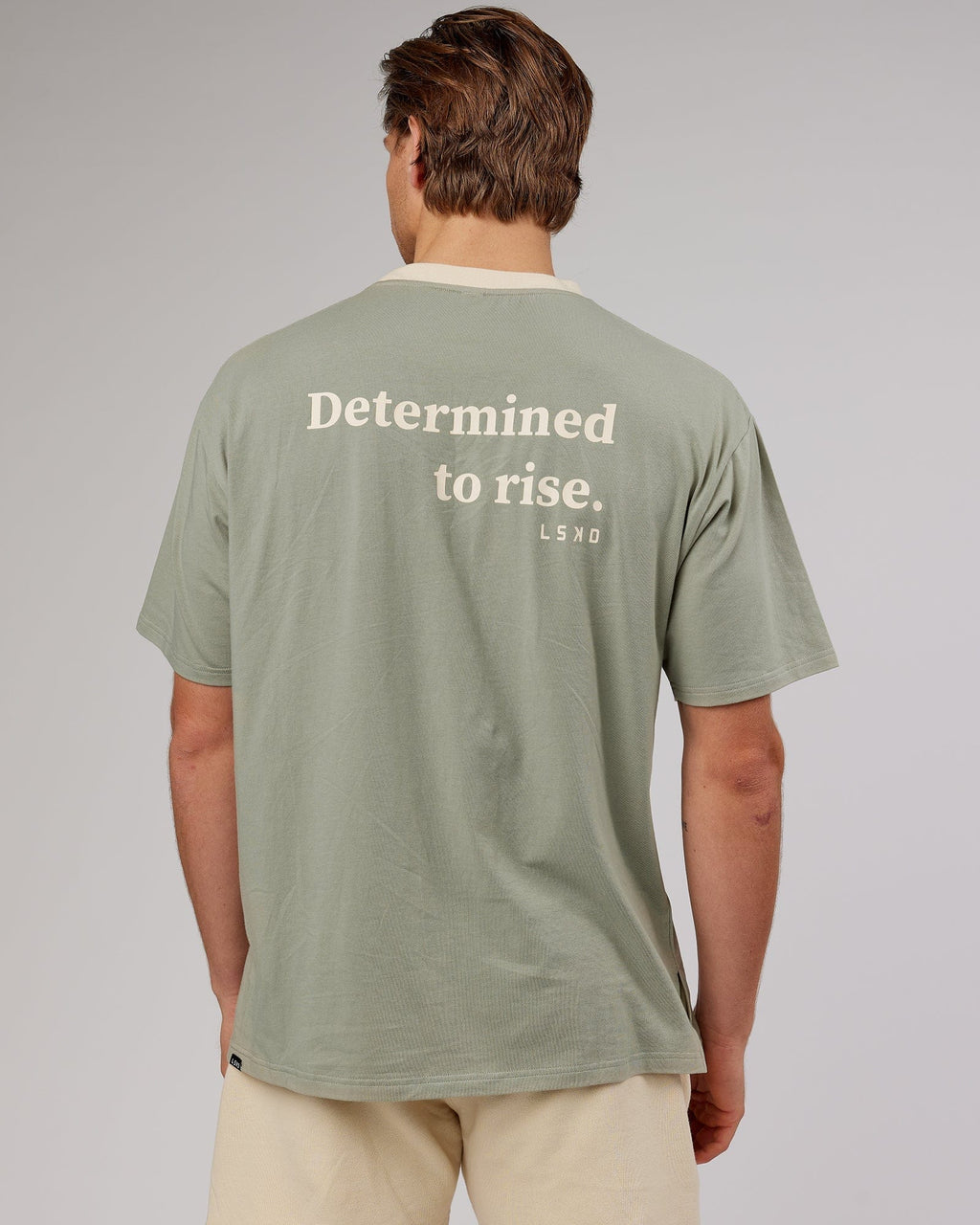 Model wearing Unisex Rise FLXCotton Oversize Tee - Sage