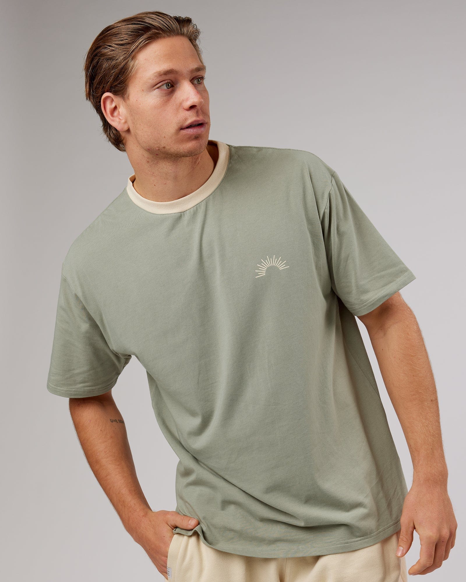 Model wearing Unisex Rise FLXCotton Oversize Tee - Sage