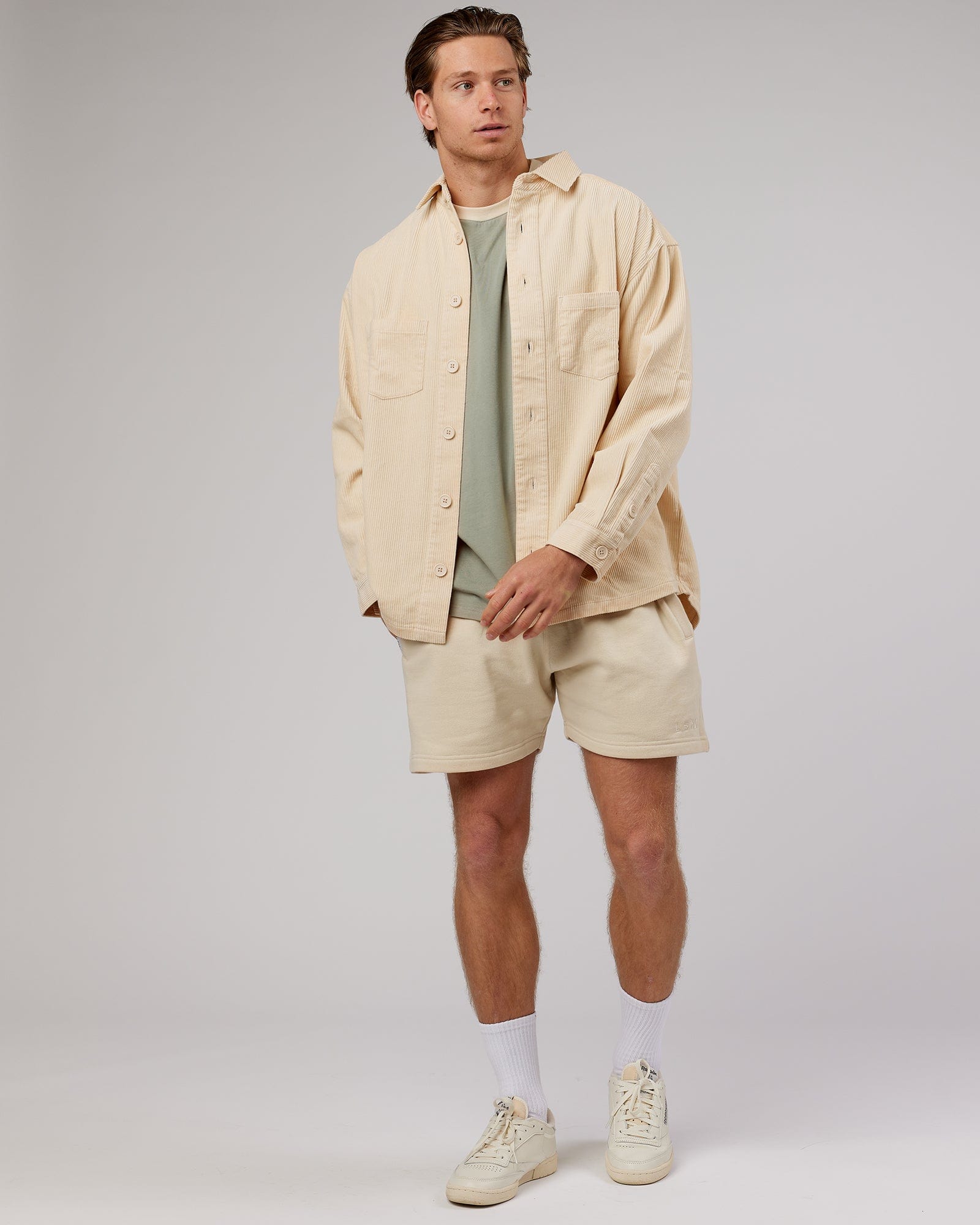 Model wearing Unisex Rise Cord Shacket - Classic Cream