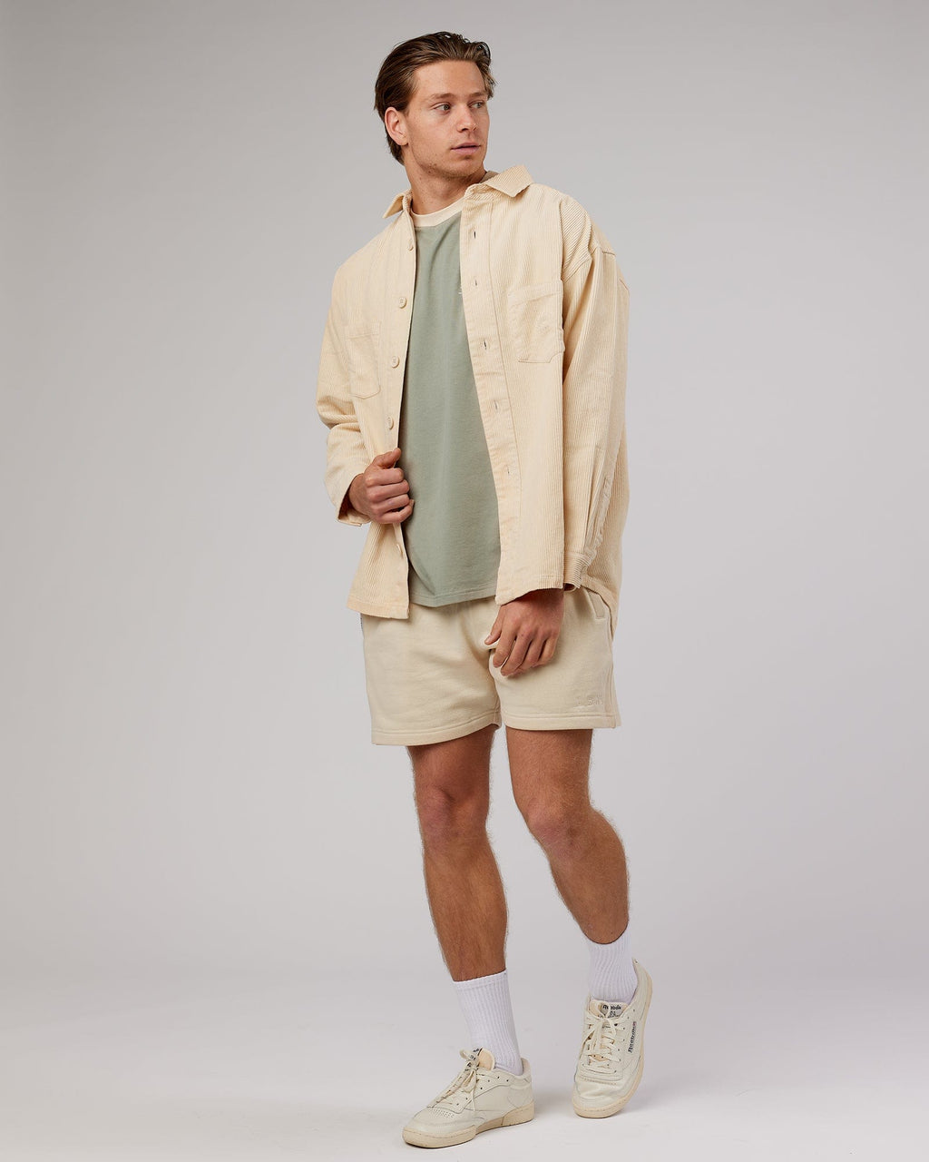 Model wearing Unisex Rise Cord Shacket - Classic Cream