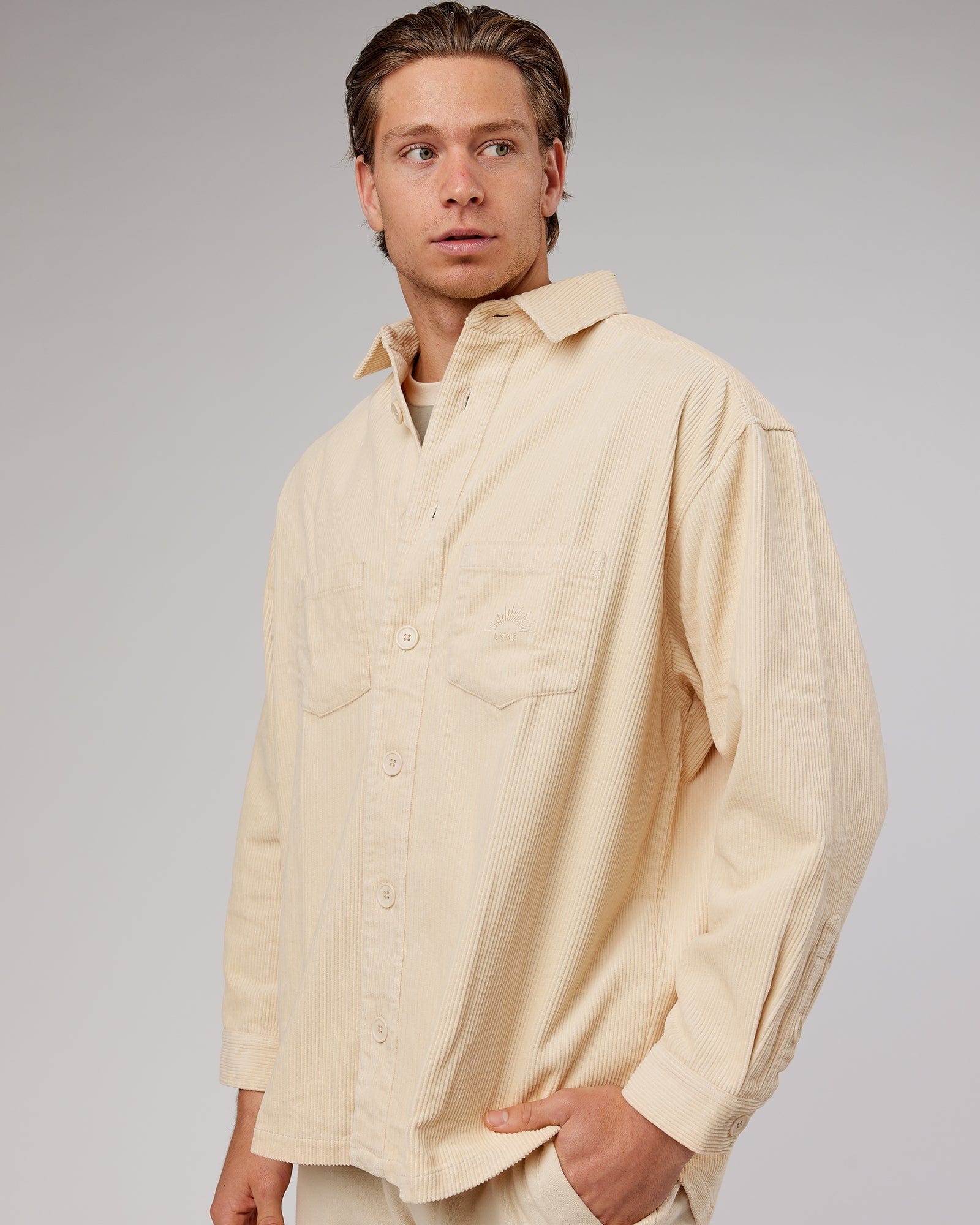 Model wearing Unisex Rise Cord Shacket - Classic Cream