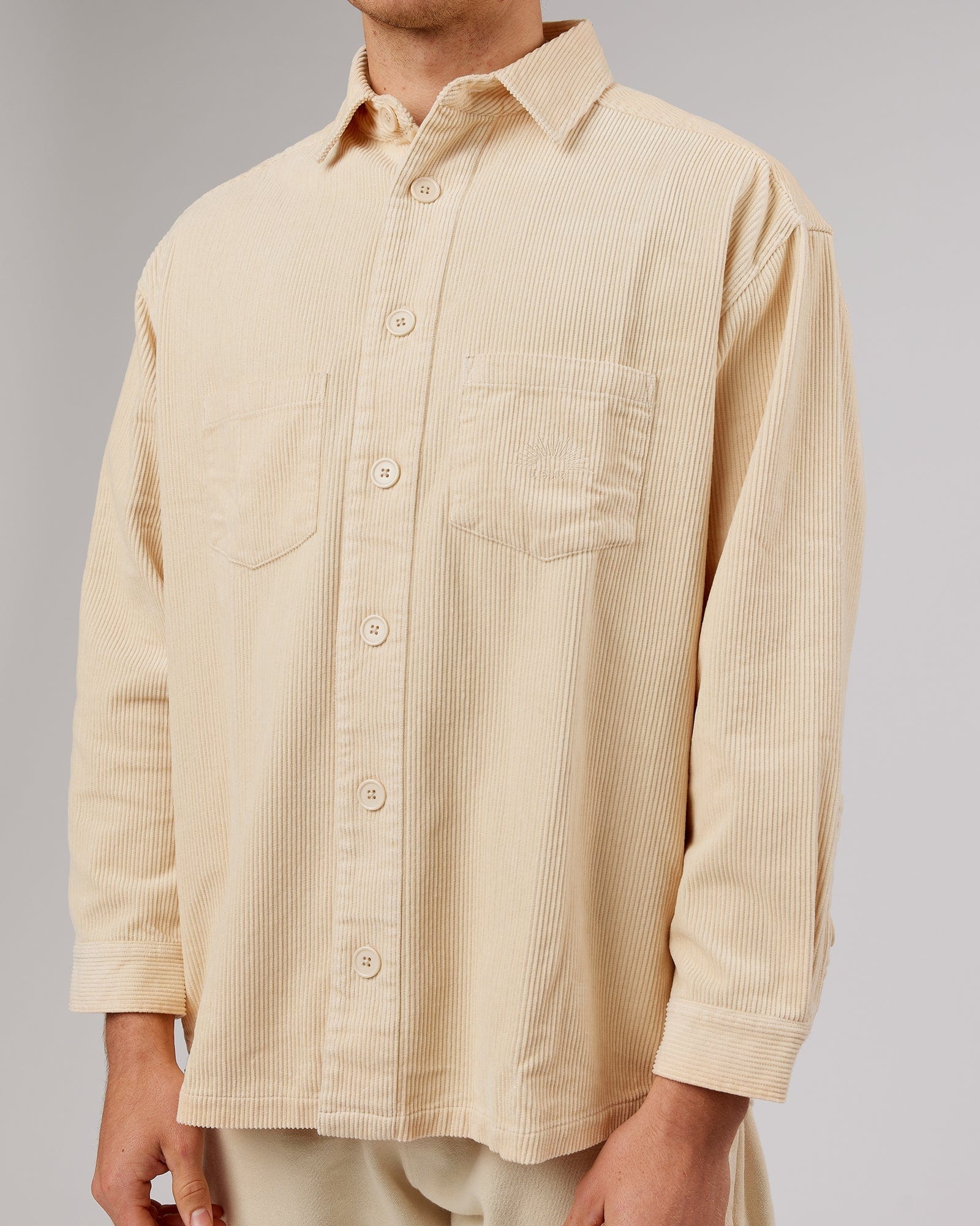 Model wearing Unisex Rise Cord Shacket - Classic Cream