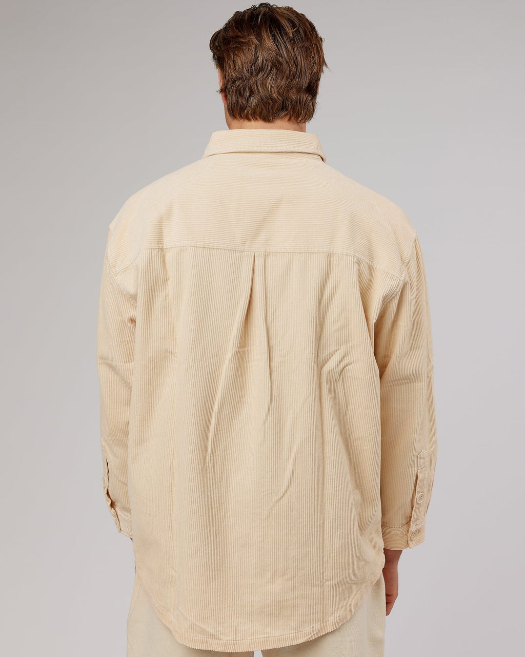 Model wearing Unisex Rise Cord Shacket - Classic Cream