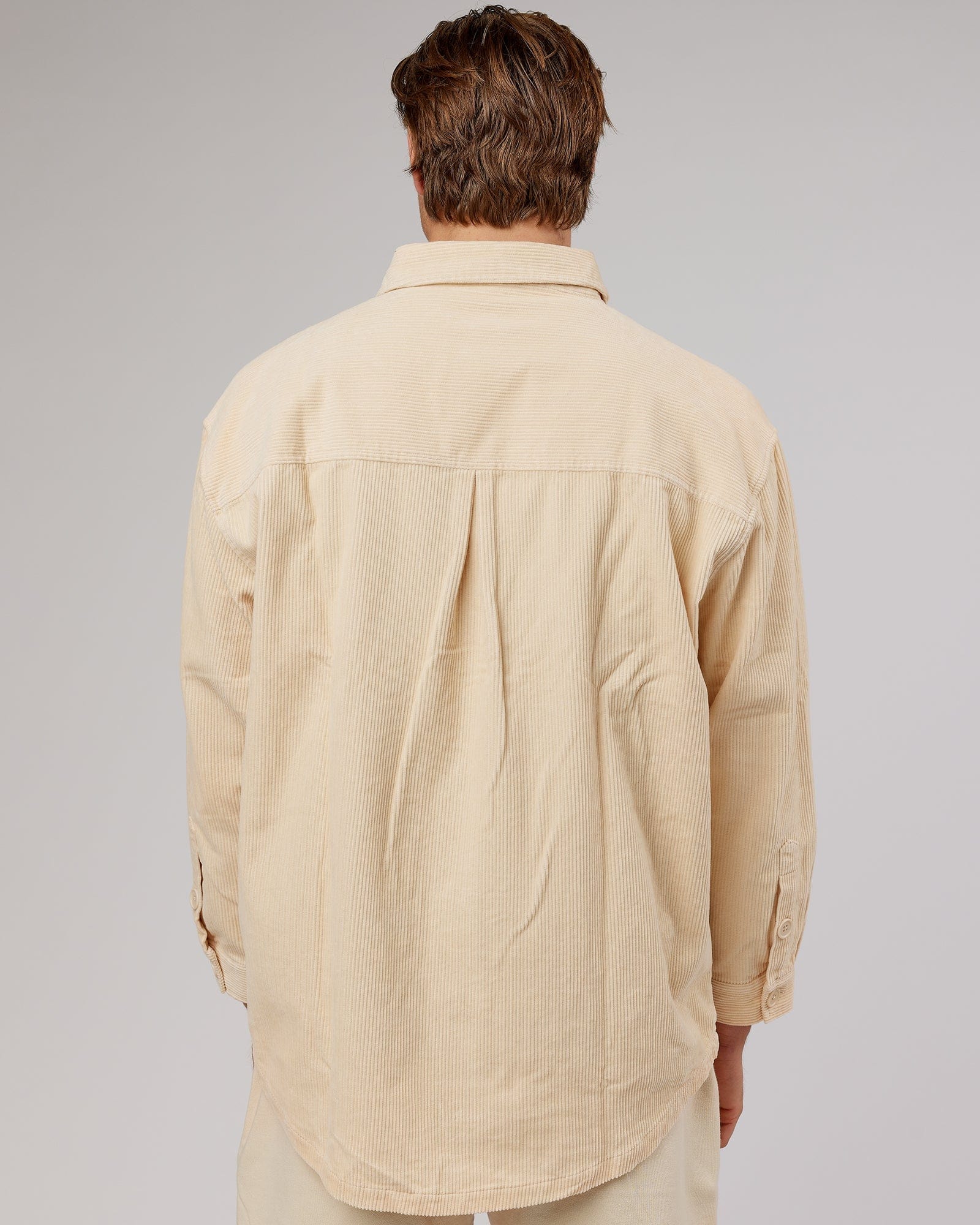 Model wearing Unisex Rise Cord Shacket - Classic Cream