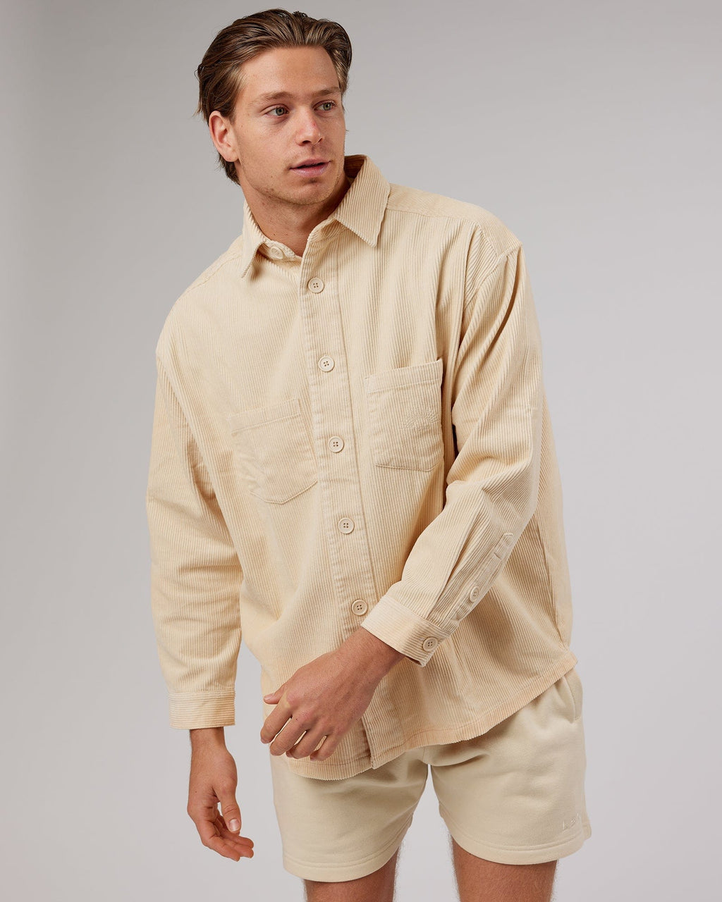 Model wearing Unisex Rise Cord Shacket - Classic Cream