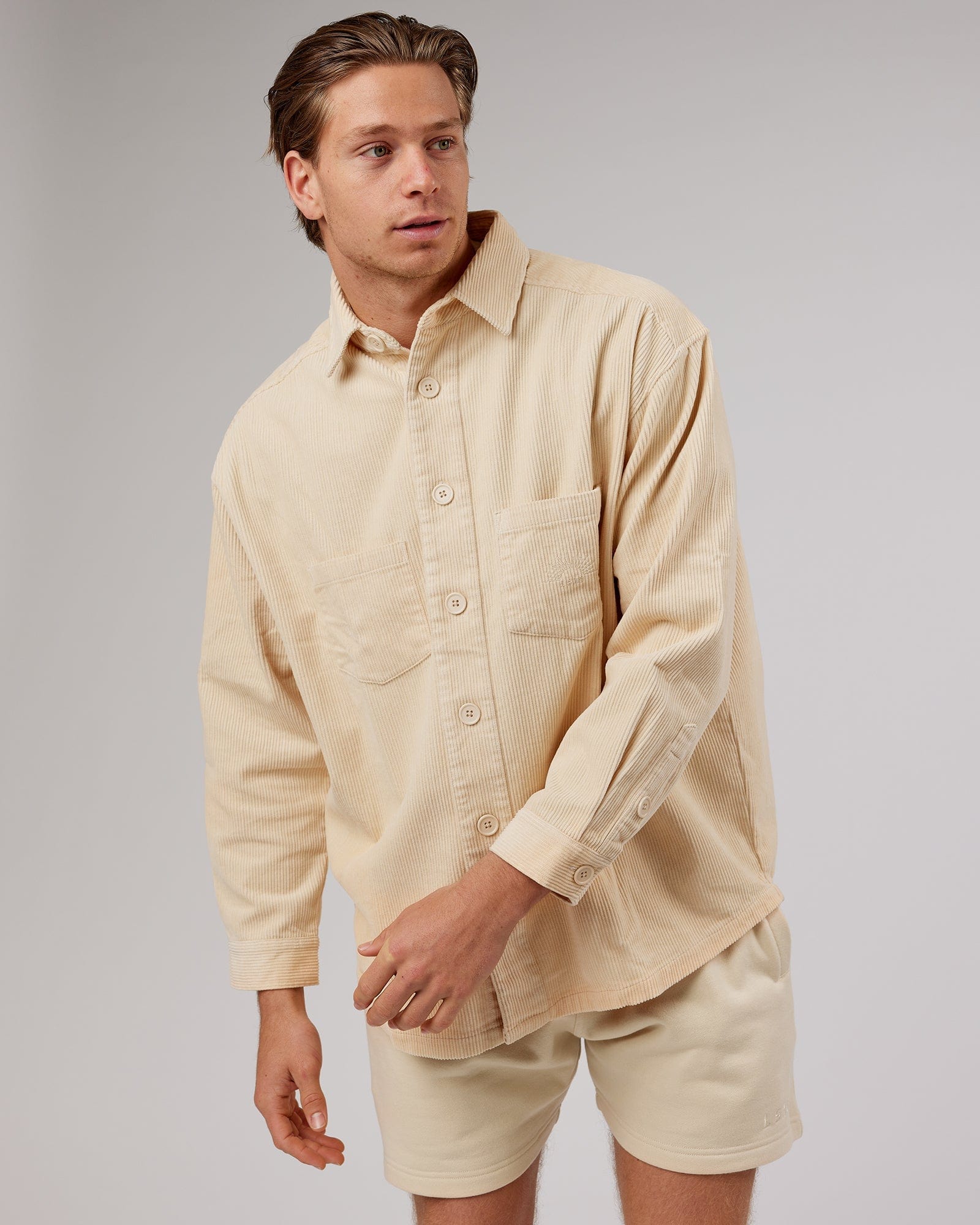 Model wearing Unisex Rise Cord Shacket - Classic Cream