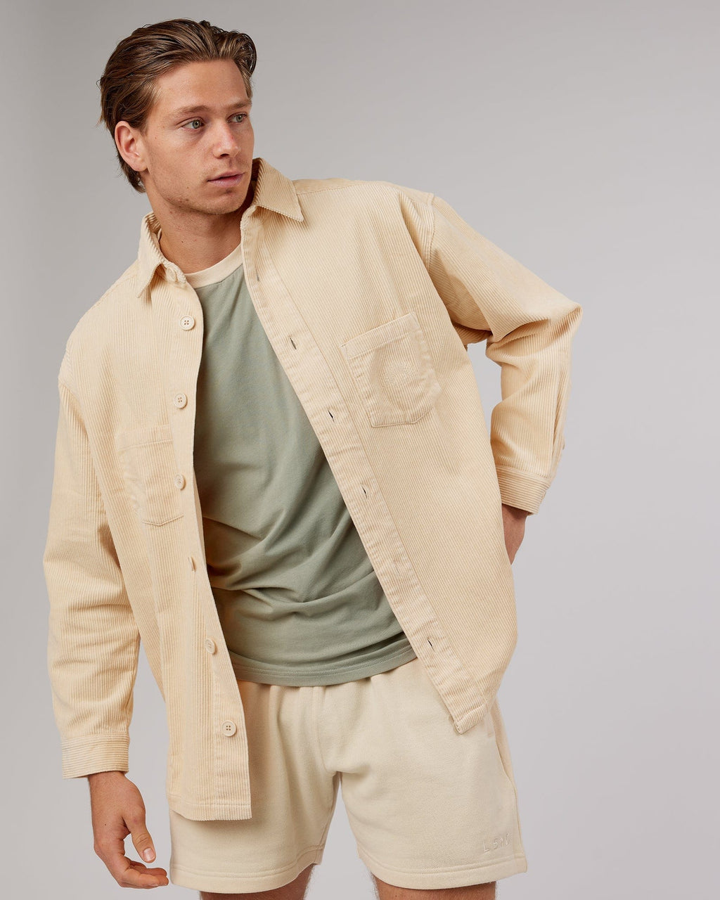 Model wearing Unisex Rise Cord Shacket - Classic Cream
