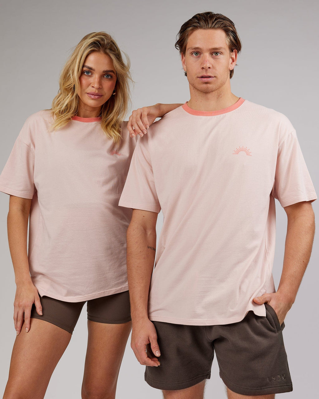 Model wearing Unisex Rise FLXCotton Oversize Tee - Peach Flush