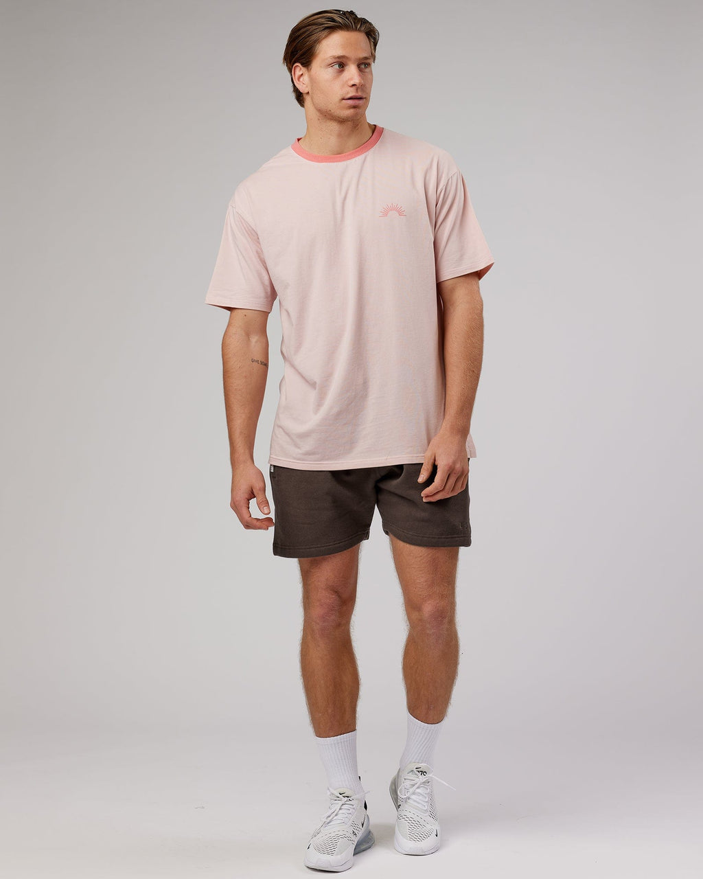 Model wearing Rise Track Short - Mocha