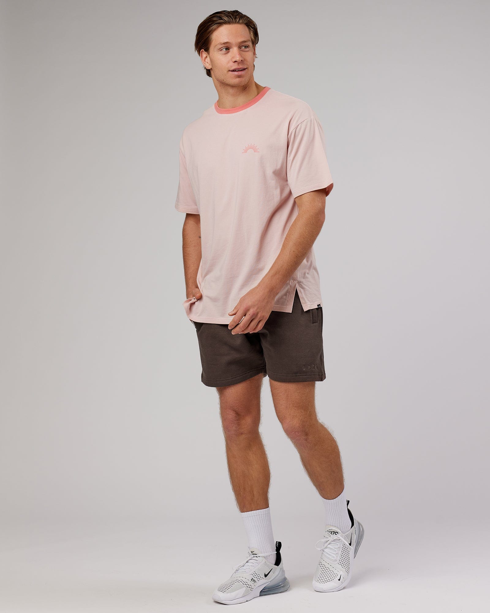 Model wearing Unisex Rise FLXCotton Oversize Tee - Peach Flush