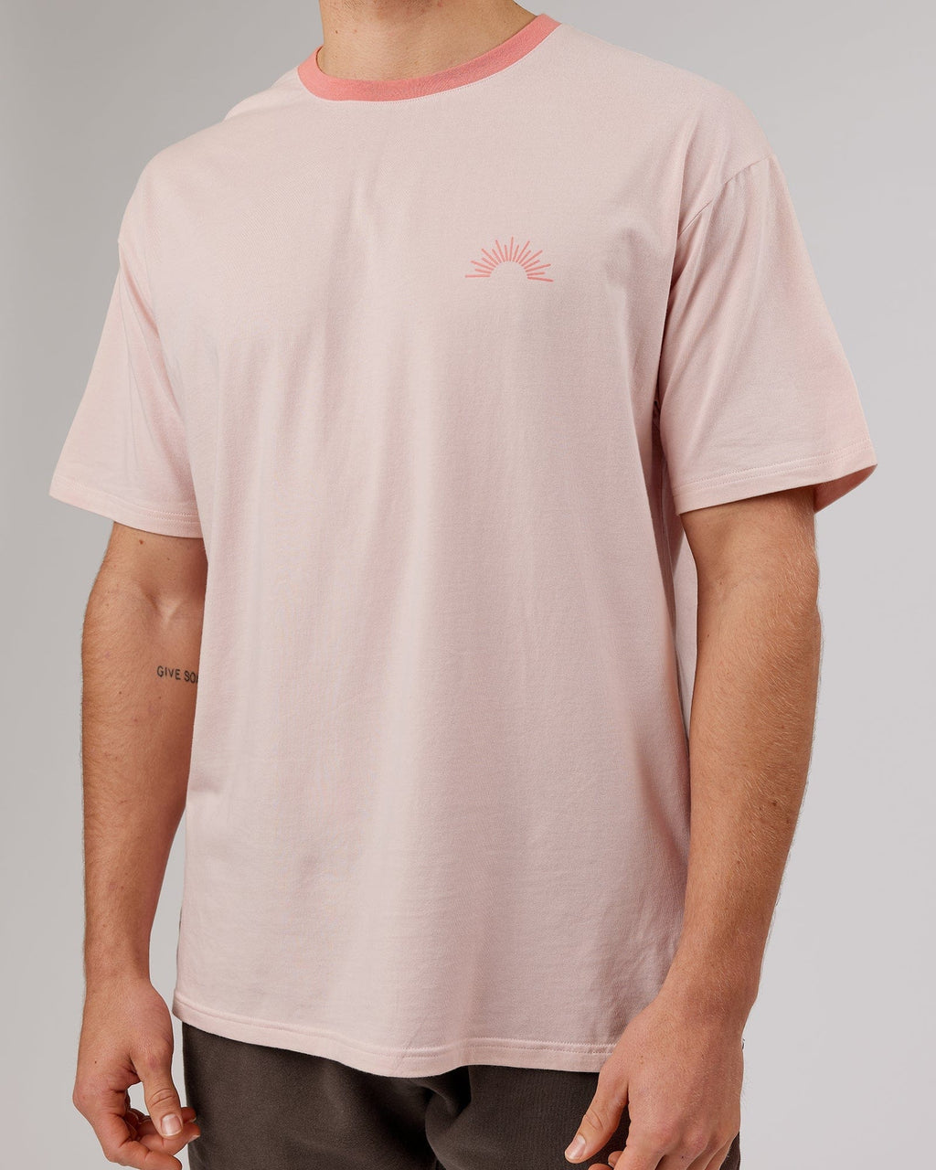 Model wearing Unisex Rise FLXCotton Oversize Tee - Peach Flush