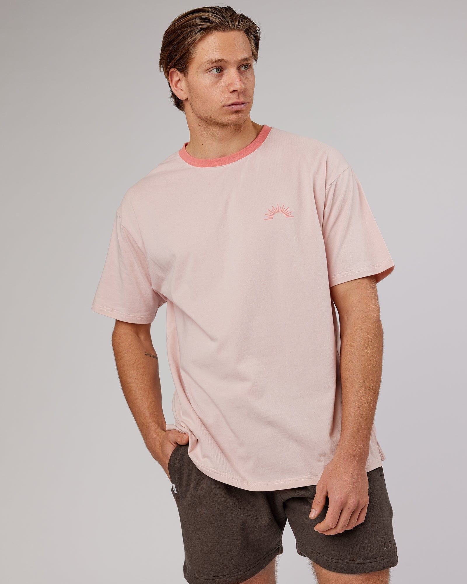 Model wearing Unisex Rise FLXCotton Oversize Tee - Peach Flush