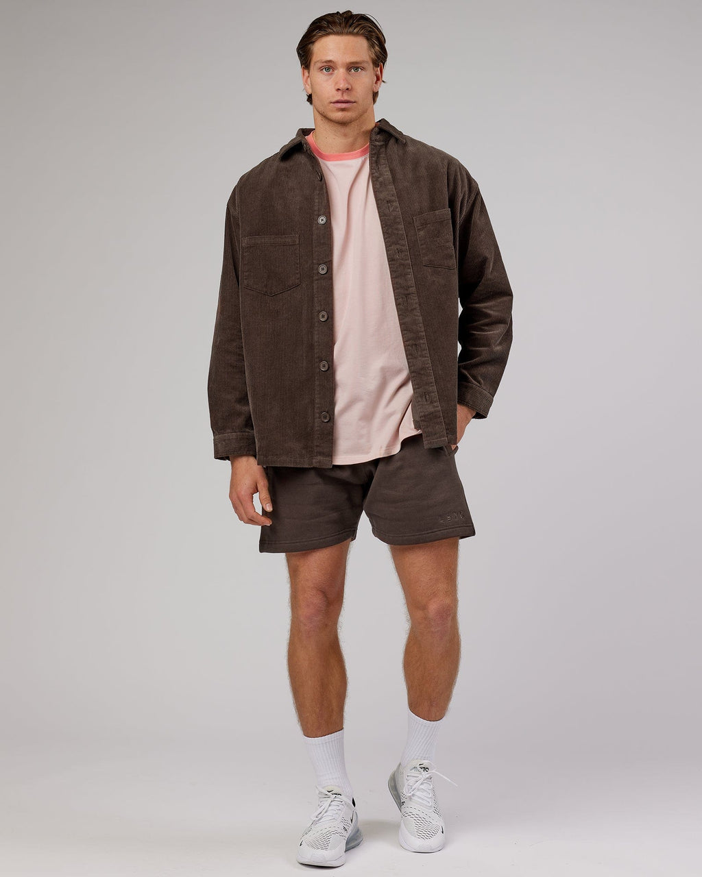 Model wearing Rise Track Short - Mocha