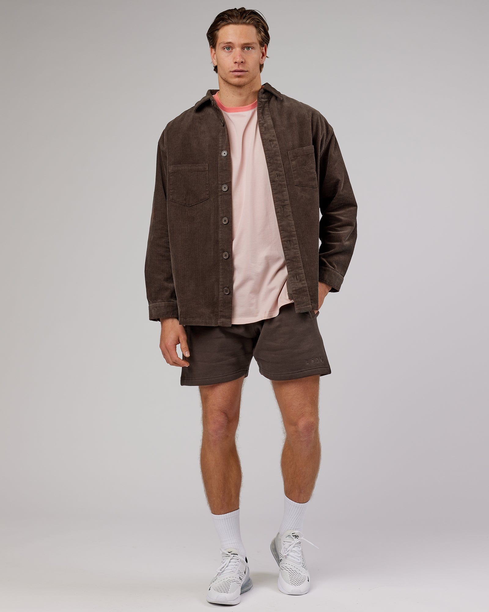 Model wearing Rise Track Short - Mocha