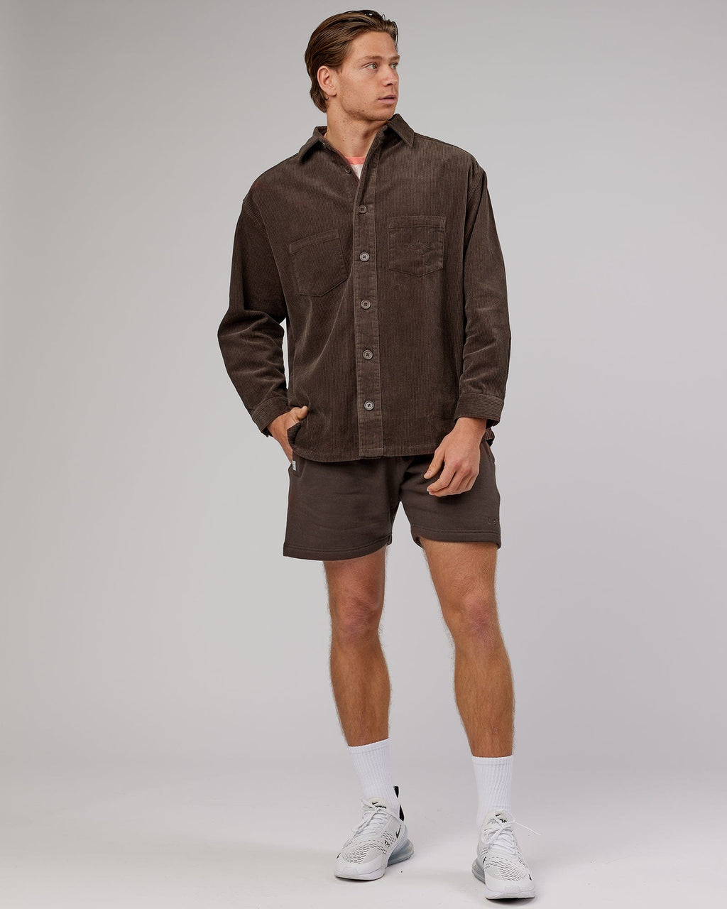 Model wearing Unisex Rise Cord Shacket - Mocha