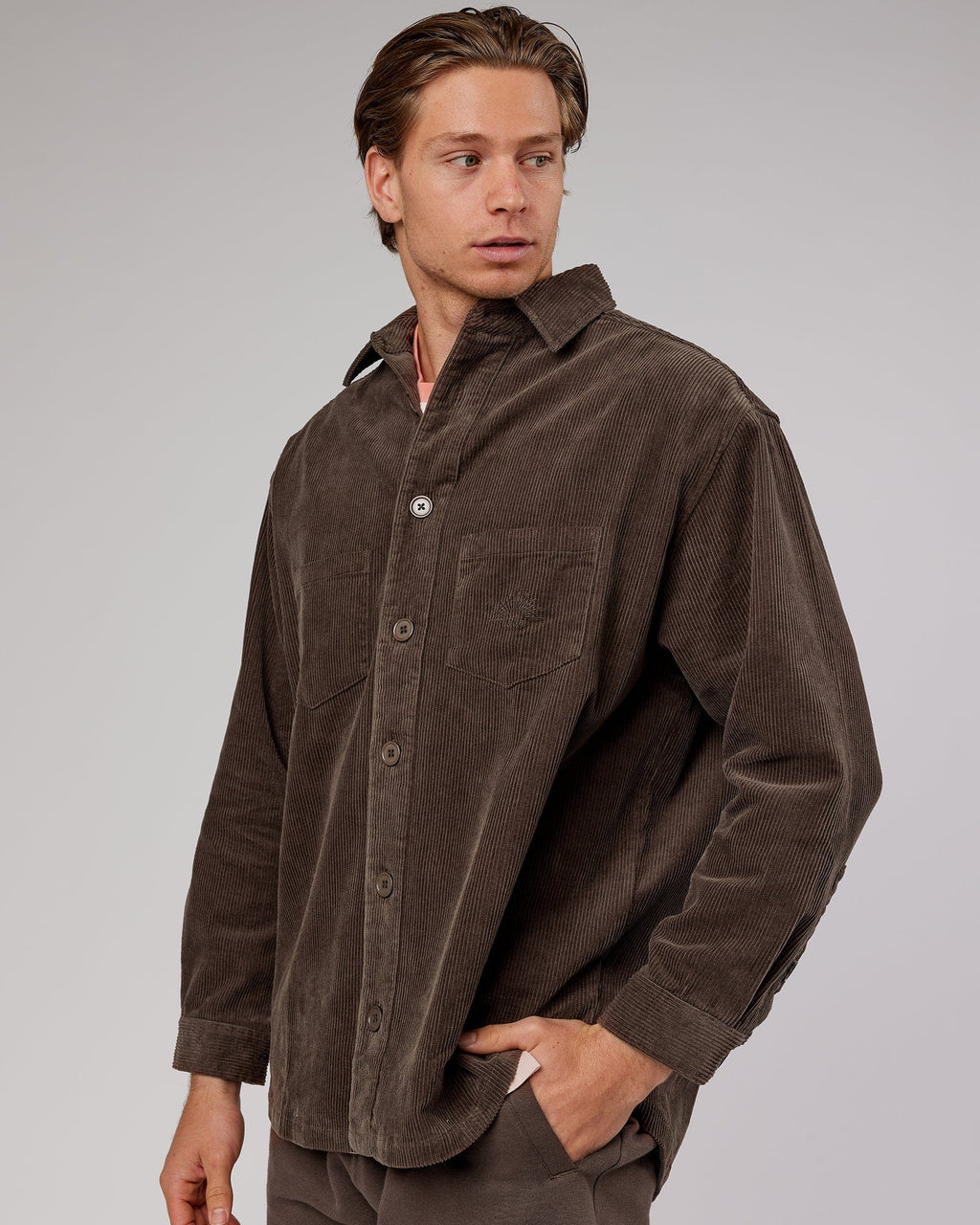 Model wearing Unisex Rise Cord Shacket - Mocha