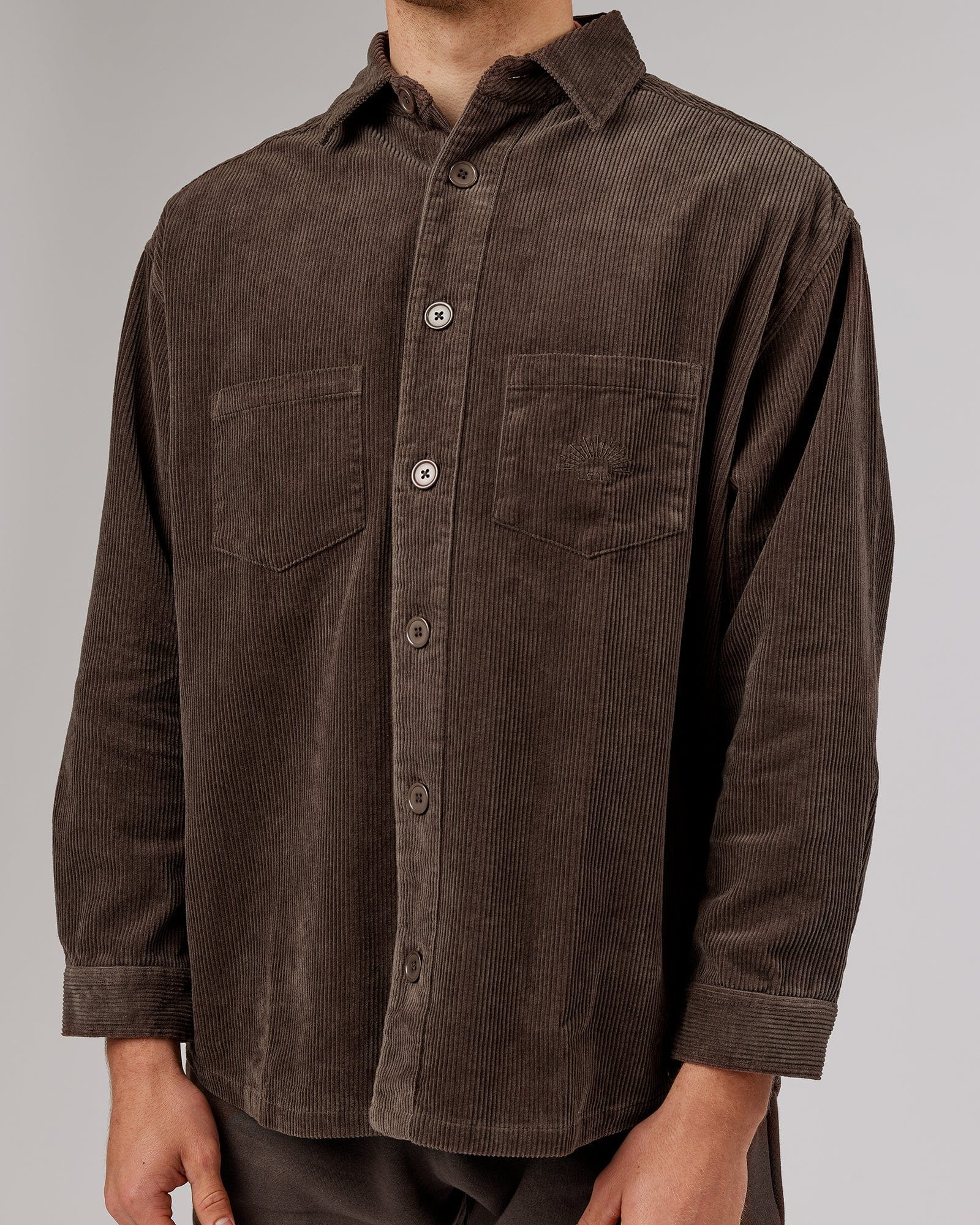 Model wearing Unisex Rise Cord Shacket - Mocha