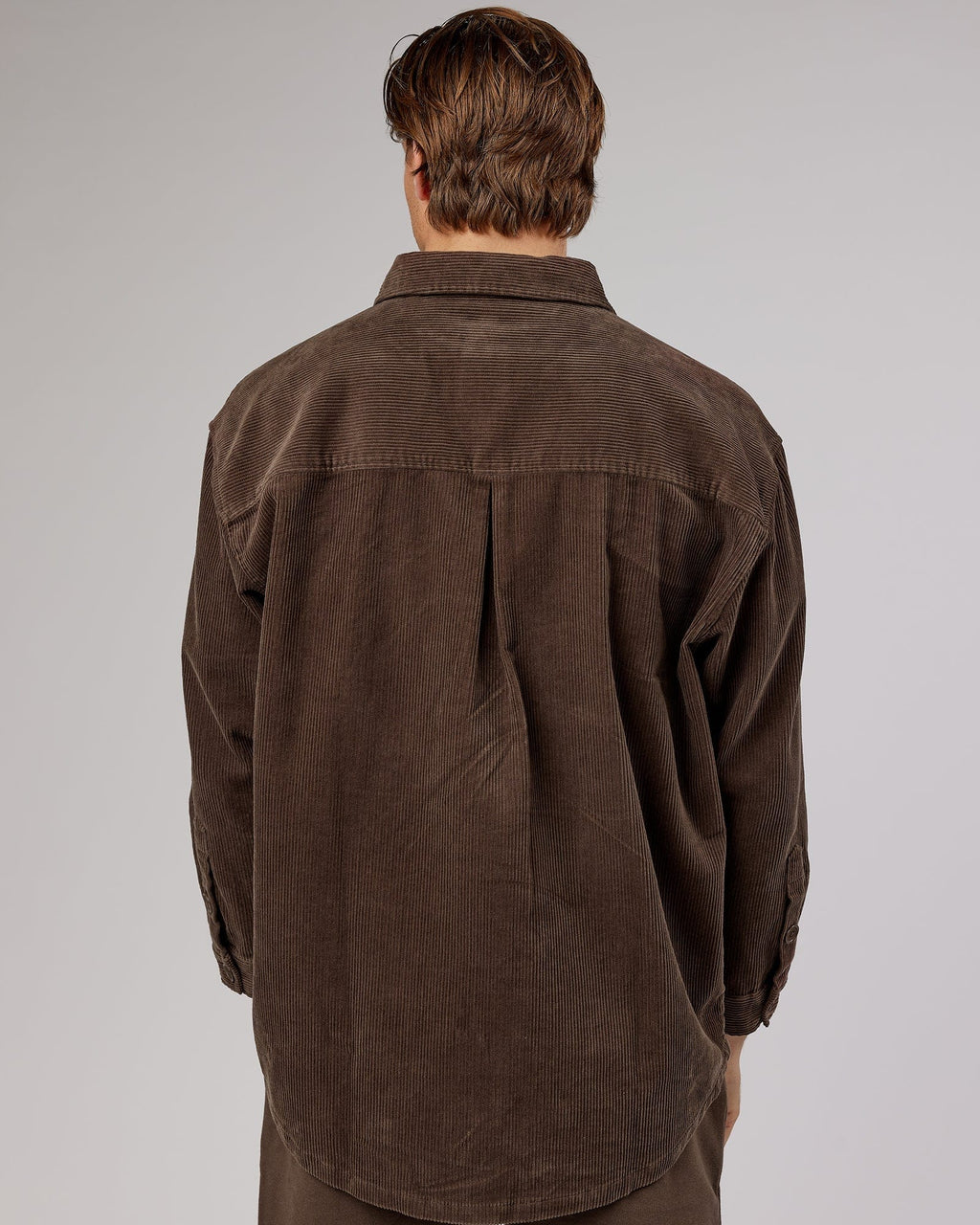 Model wearing Unisex Rise Cord Shacket - Mocha