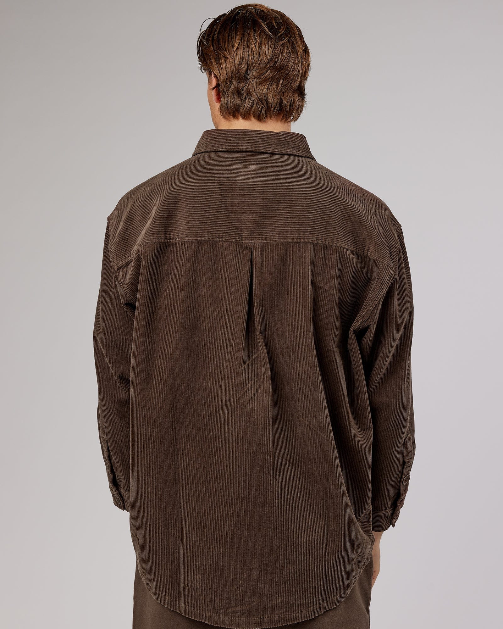 Model wearing Unisex Rise Cord Shacket - Mocha