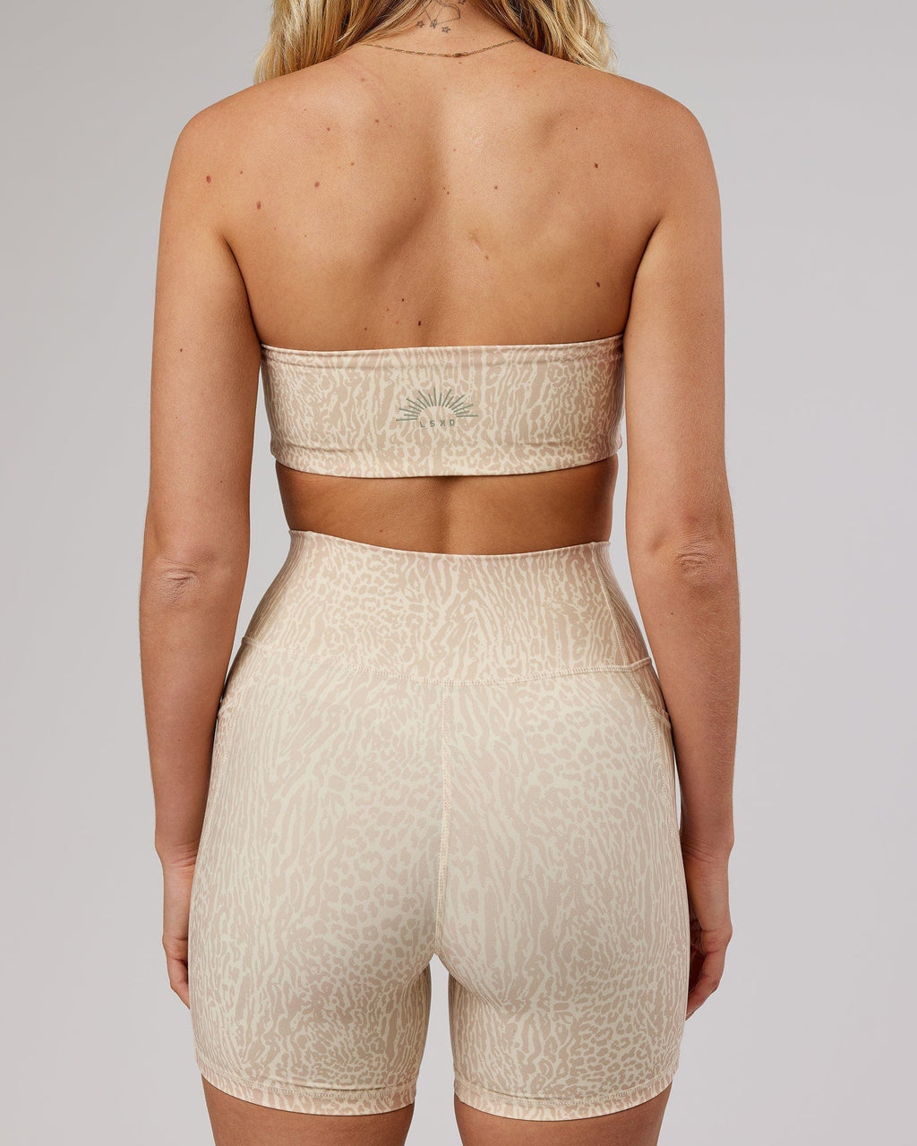 Model wearing Energise Bandeau - Rise Print