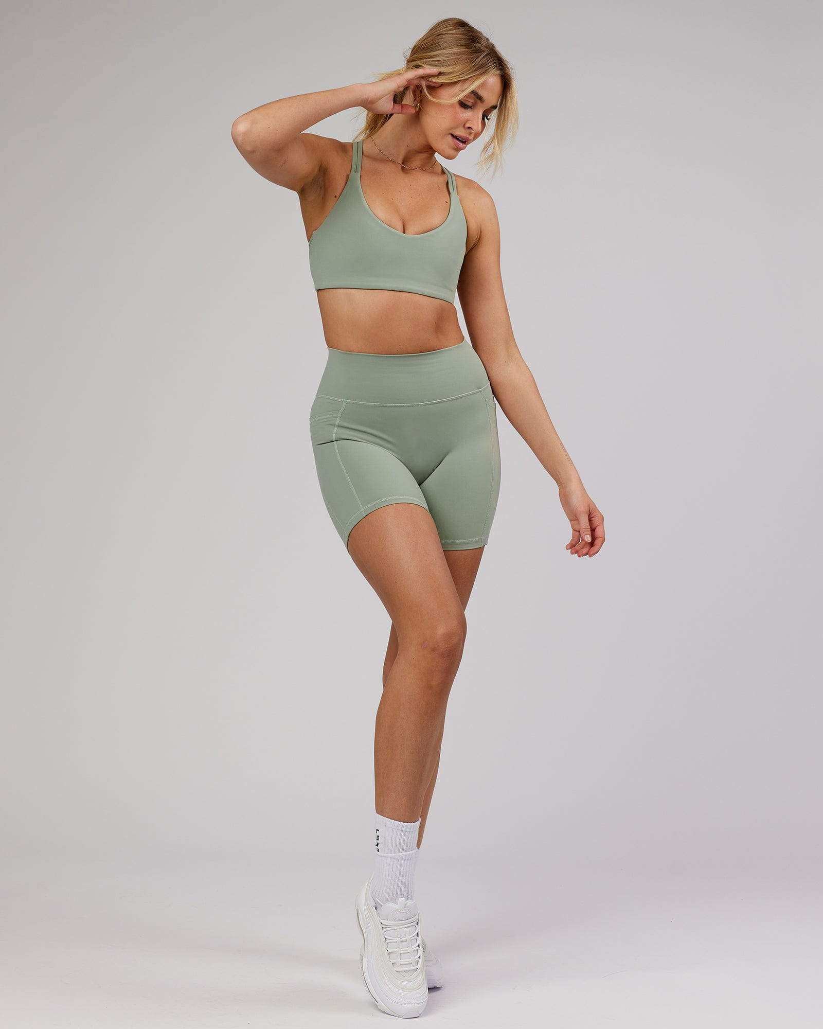 Model wearing Uplift Sports Bra - Sage