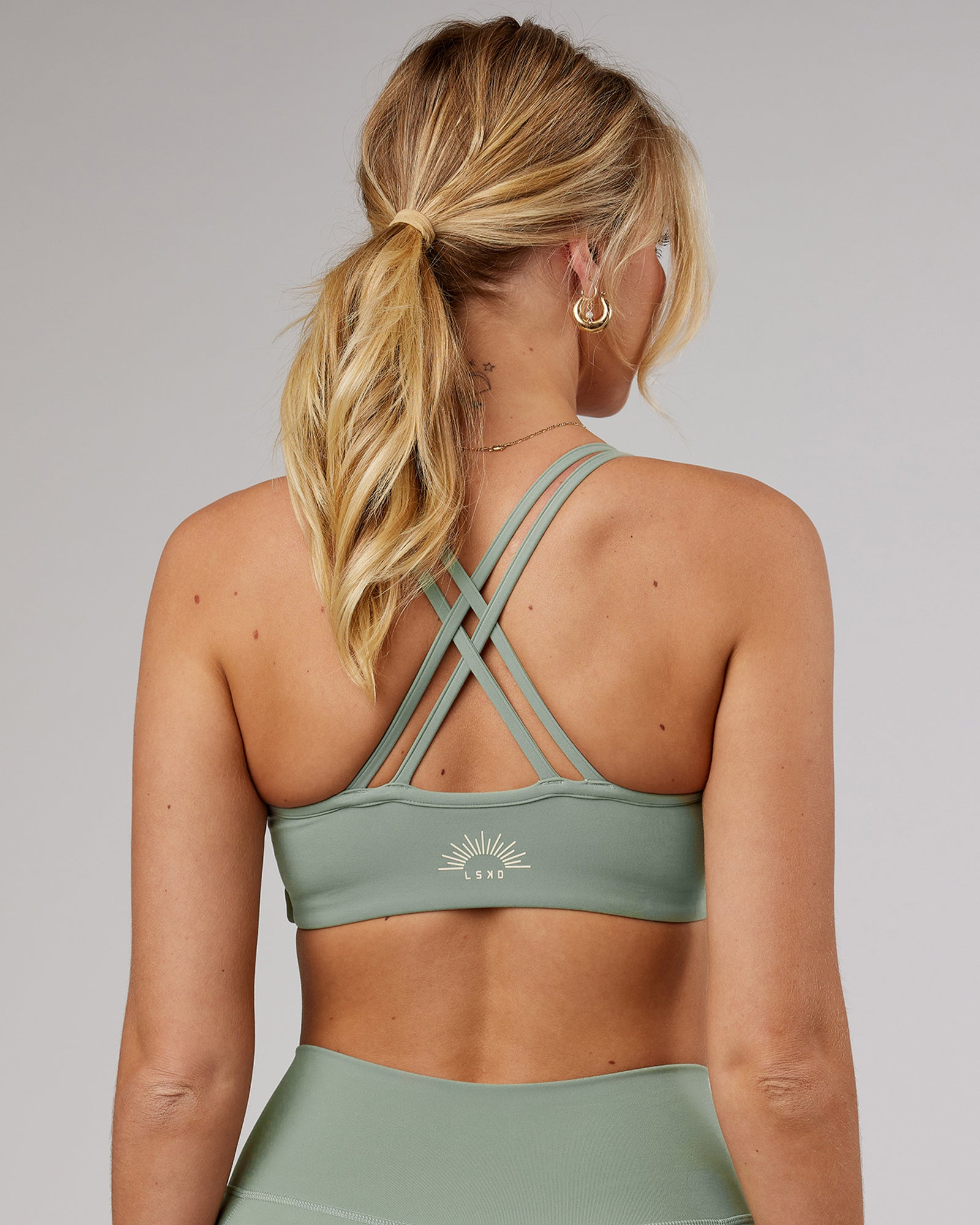 Model wearing Uplift Recycled Sports Bra - Sage