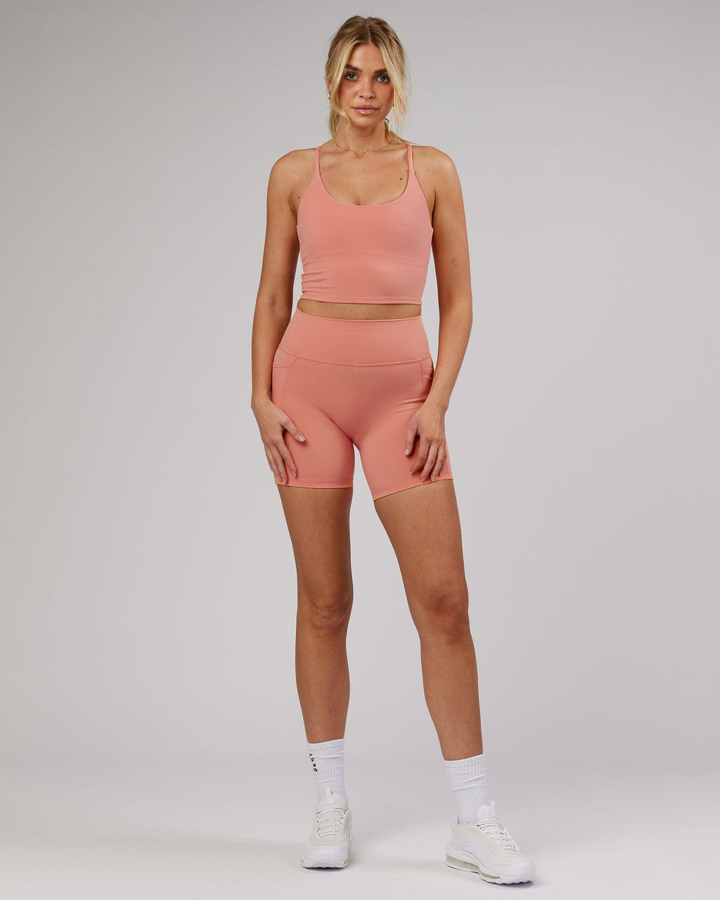 Model wearing Determined Shelf Sports Tank - Peach