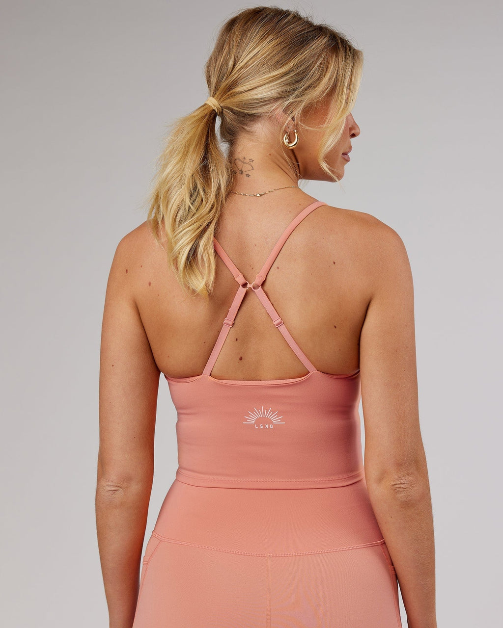 Model wearing Determined Shelf Sports Tank - Peach