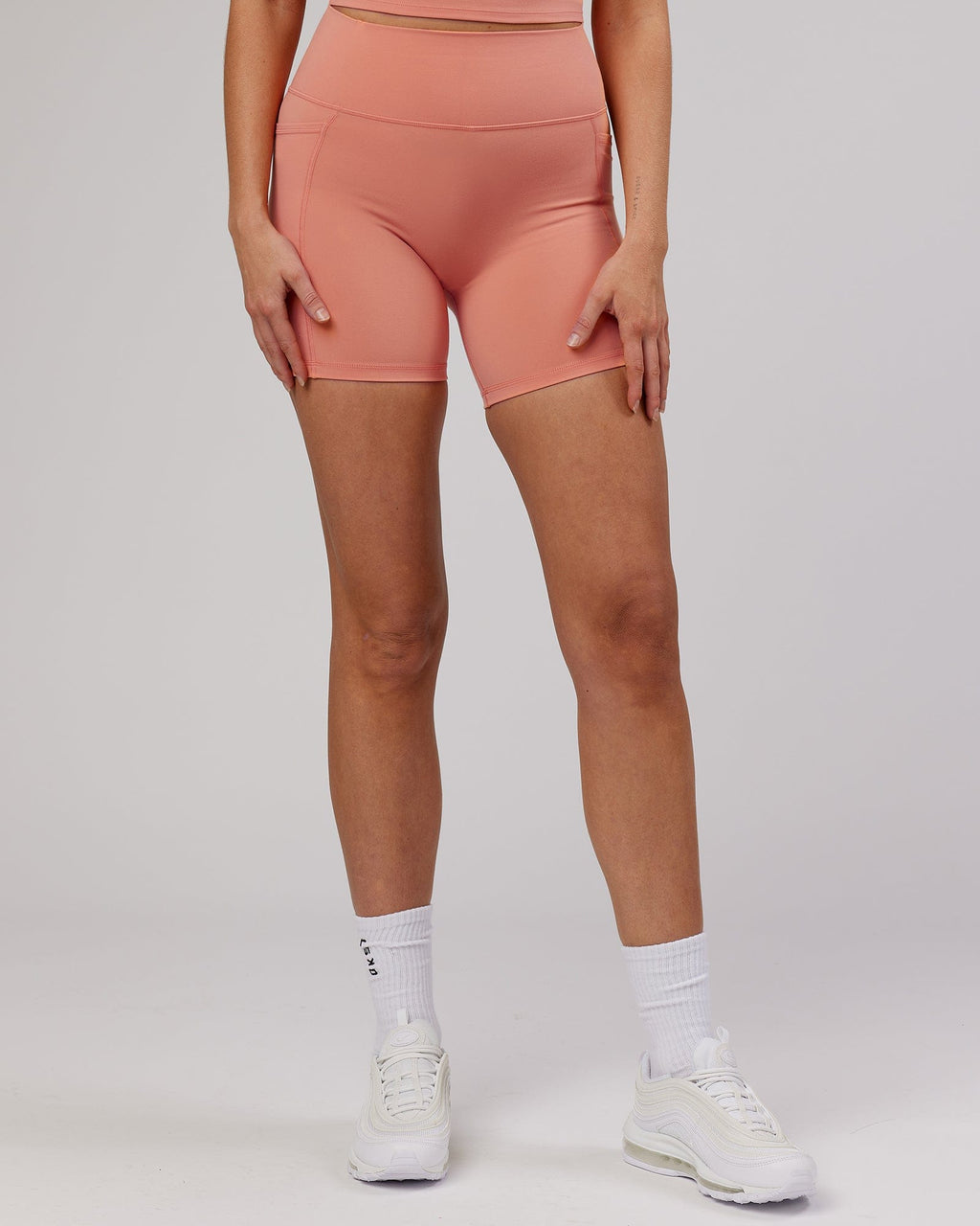 Model wearing Energise Mid Short Tight - Peach
