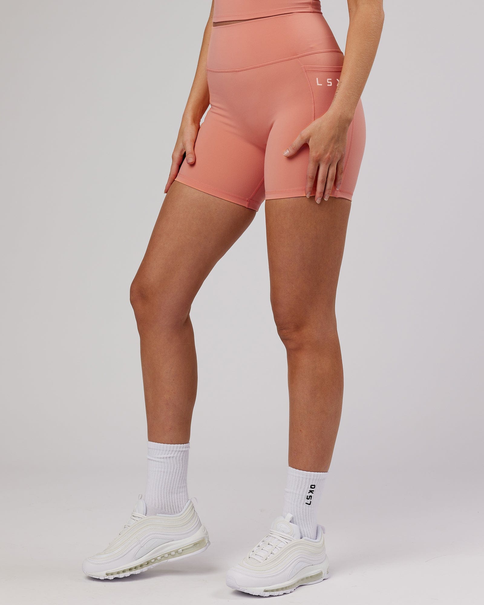 Model wearing Energise Mid Short Tight - Peach