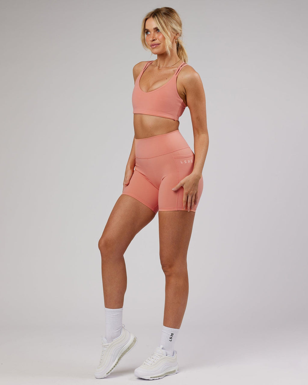 Model wearing Uplift Recycled Sports Bra - Peach