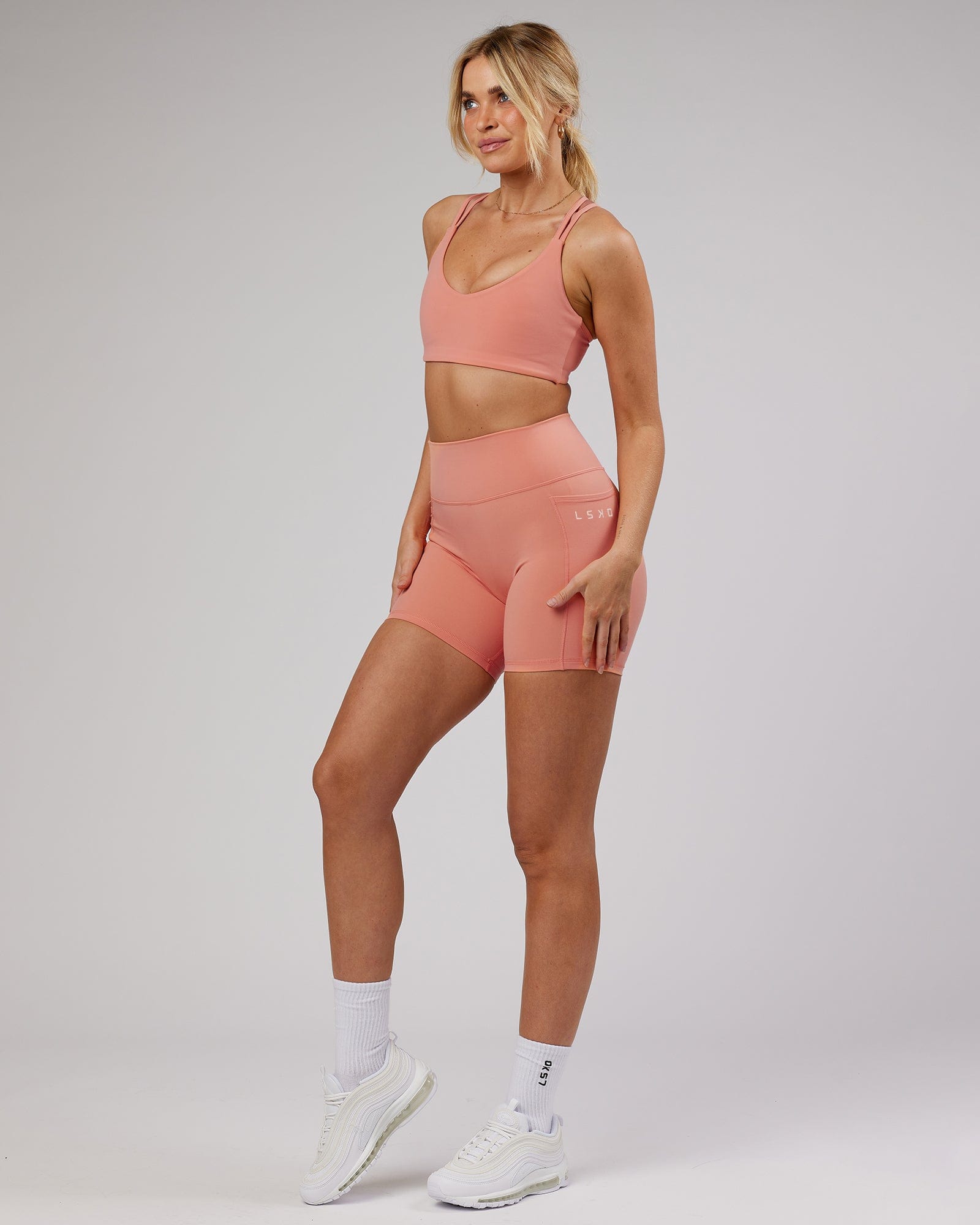 Model wearing Uplift Recycled Sports Bra - Peach