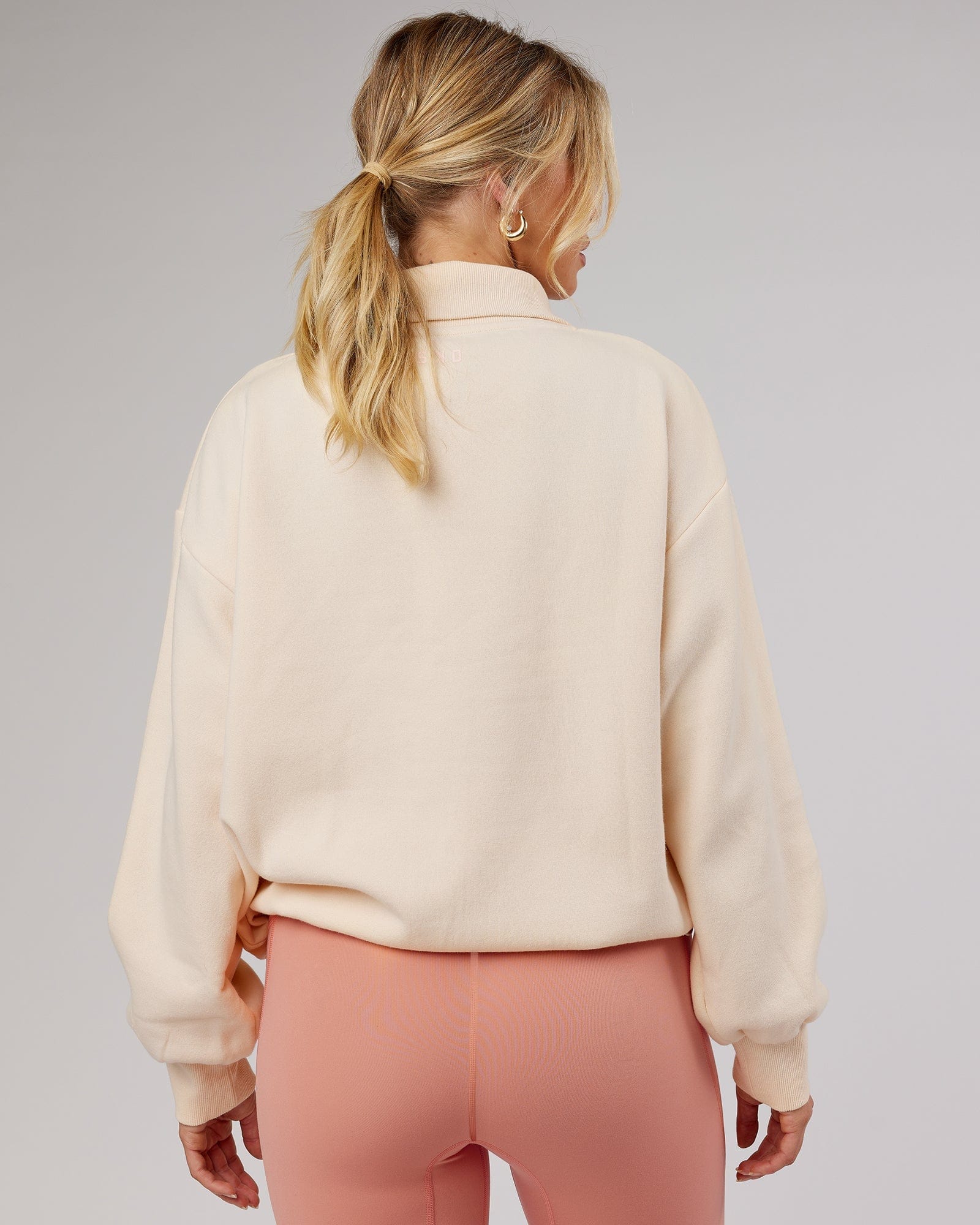 Model wearing Elevate FLXFleece 1/4 Zip Sweater - Classic Cream