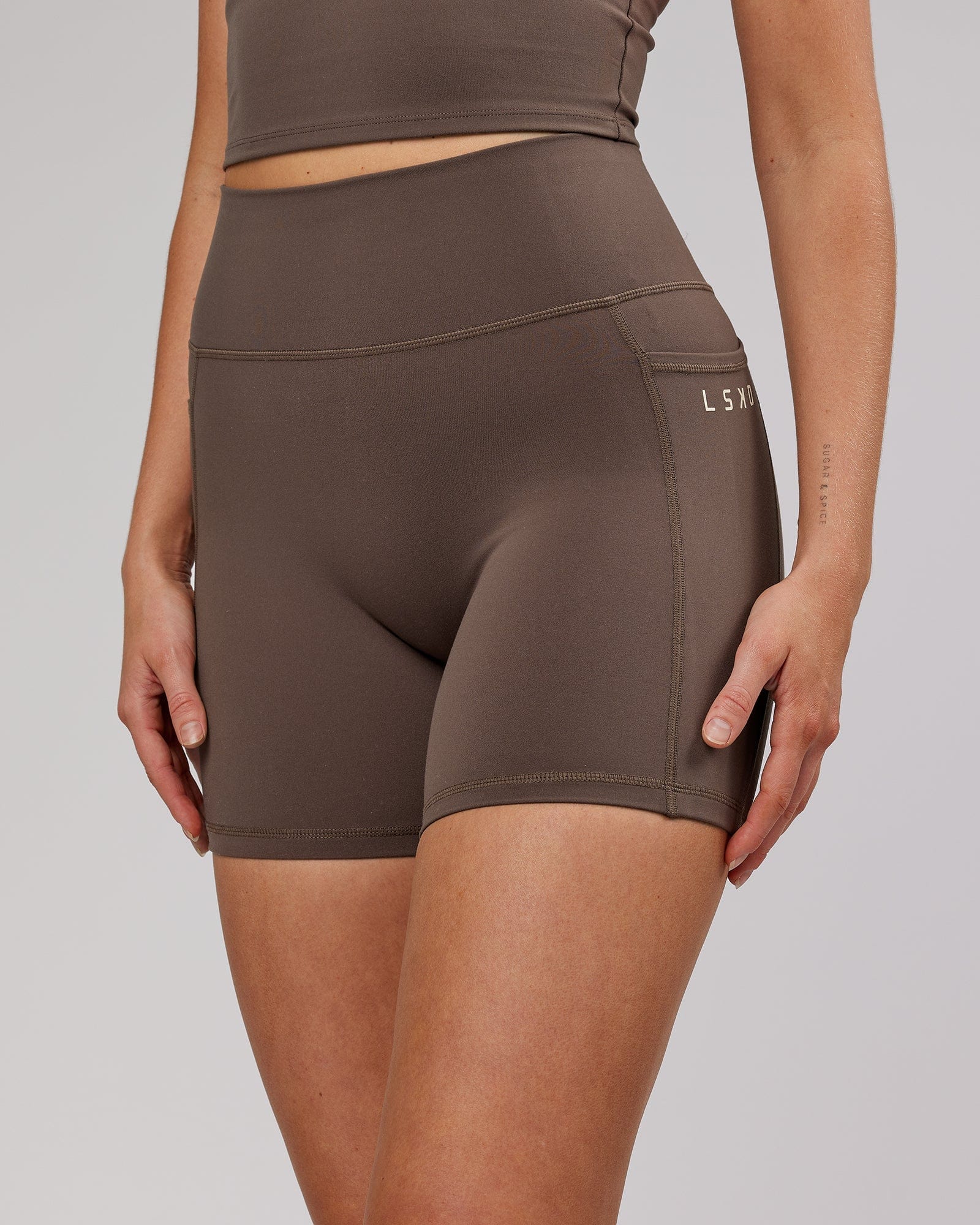 Model wearing Energise Mid Short Tight - Mocha